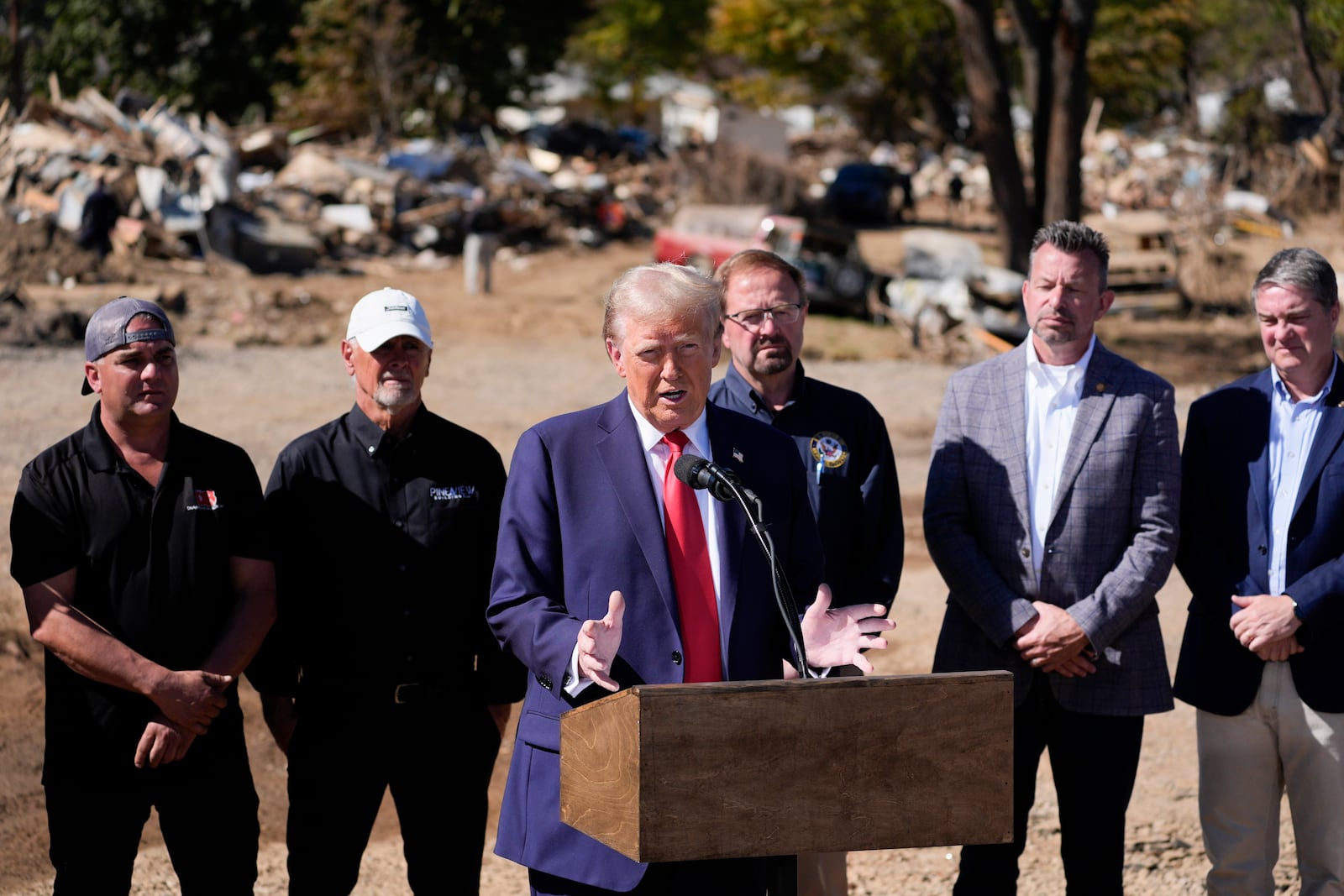 FILE - Republican presidential nominee former President Donald Trump delivers remarks on the damage and federal response to Hurricane Helene, in Swannanoa, N.C., Oct. 21, 2024. (AP Photo/Evan Vucci, File)