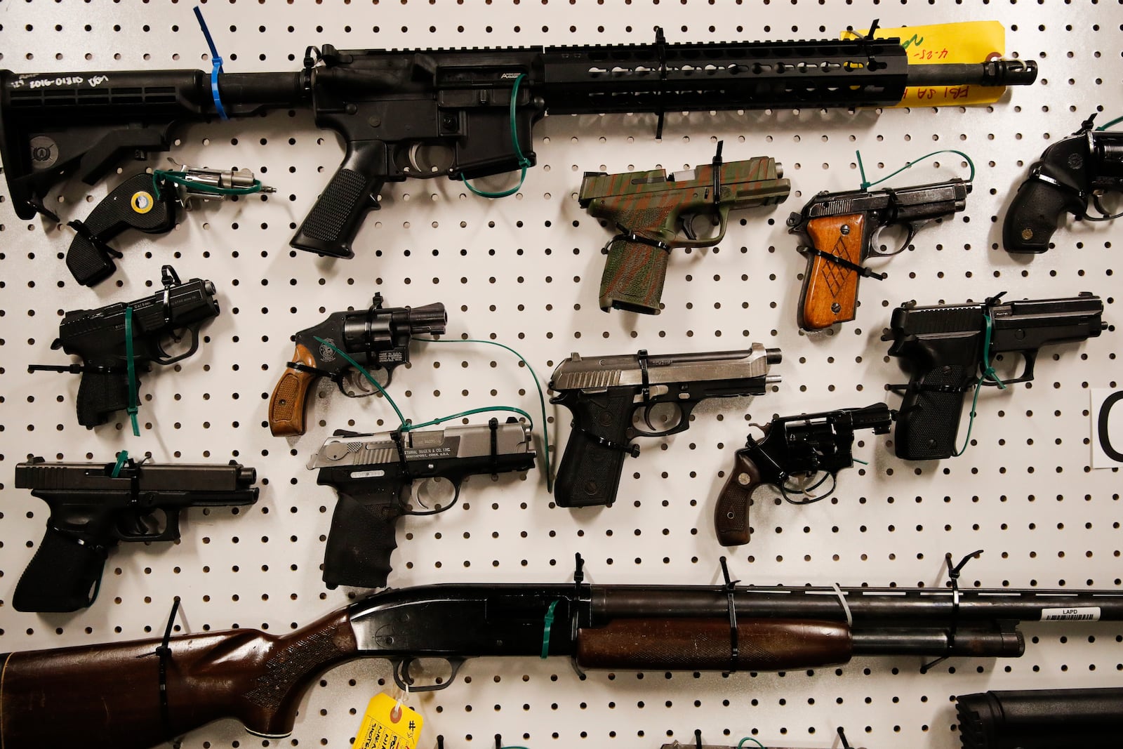 FILE - Seized firearms are displayed during a news conference Wednesday, Feb. 13, 2019, in Los Angeles. (AP Photo/Jae C. Hong, File)