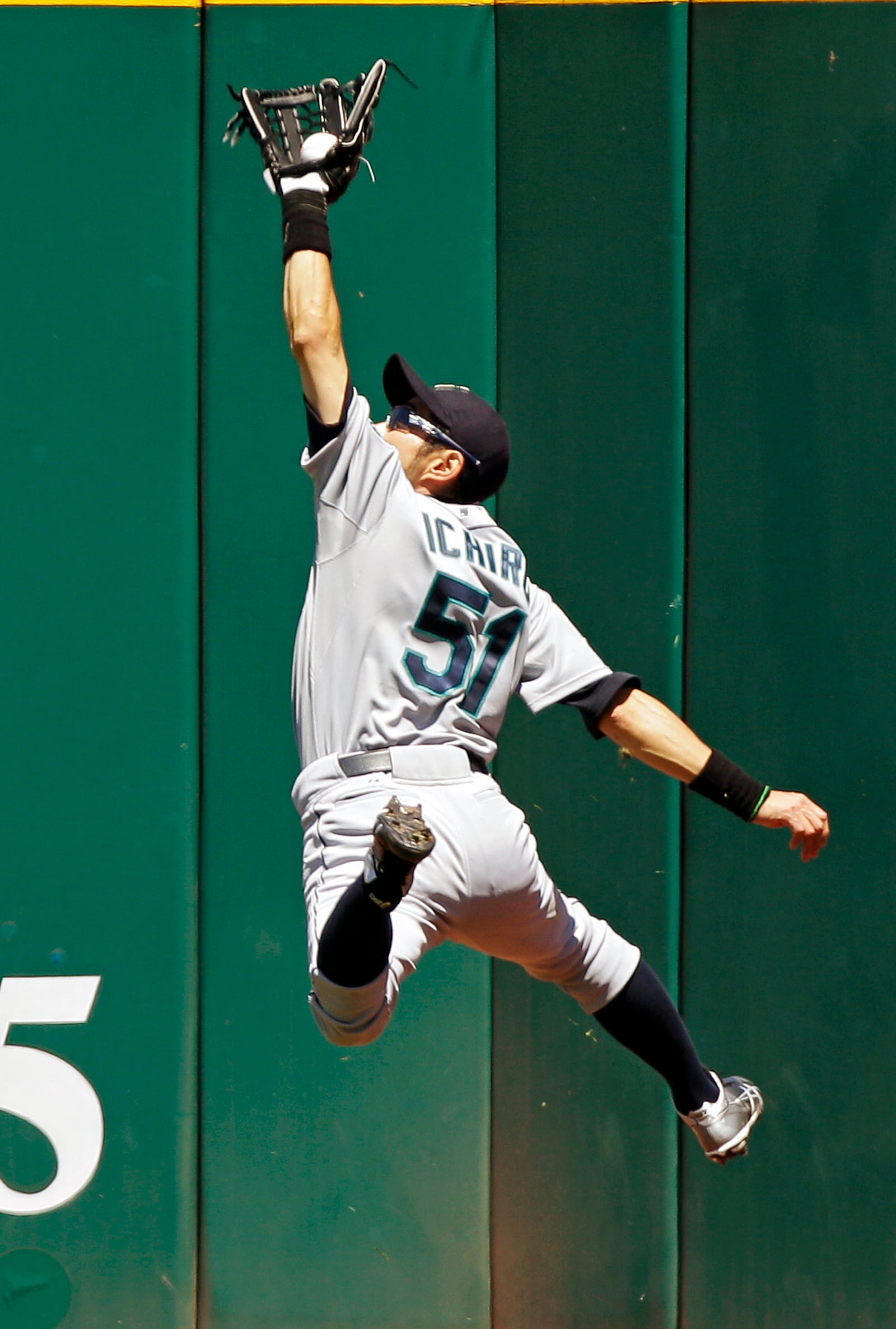 FILE - Seattle Mariners right fielder Ichiro Suzuki, of Japan, makes a leaping catch at the wall to rob Cleveland Indians' Carlos Santana of a hit in the fourth inning of a baseball game Thursday, May 17, 2012, in Cleveland. (AP Photo/Mark Duncan, File)