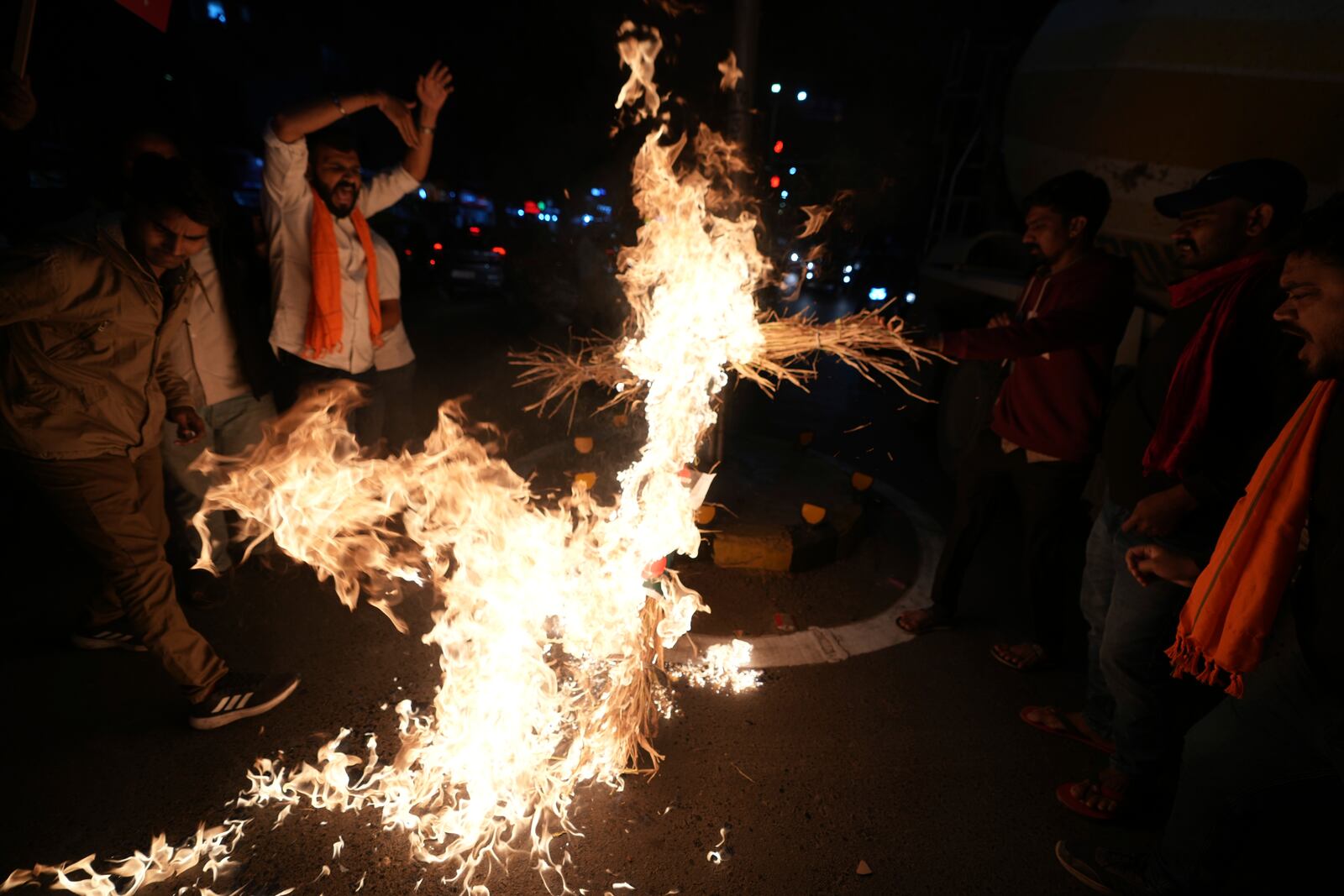 Activists of Bajarang dal, a Hindu rights group, burn an effigy of Bangladesh's interim leader Muhammad Yunus, during a protest against the alleged attacks on Hindus in Bangladesh, in Ahmedabad, India, Wednesday, Dec. 11, 2024. (AP Photo/Ajit Solanki)