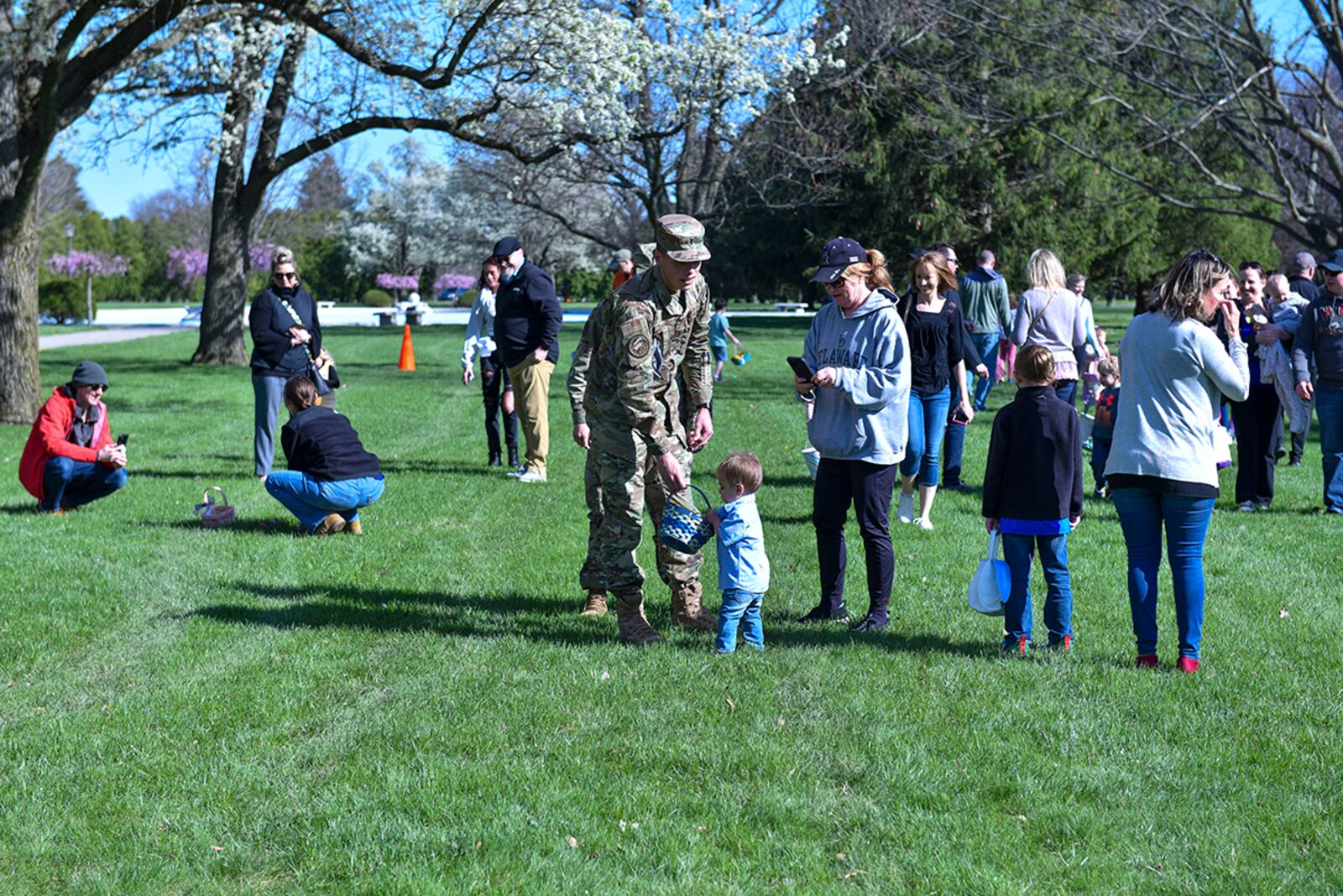 Families hunt for eggs during the Easter egg hunt at Turtle Pond on April 15. U.S. AIR FORCE PHOTO/SENIOR AIRMAN JACK GARDNER