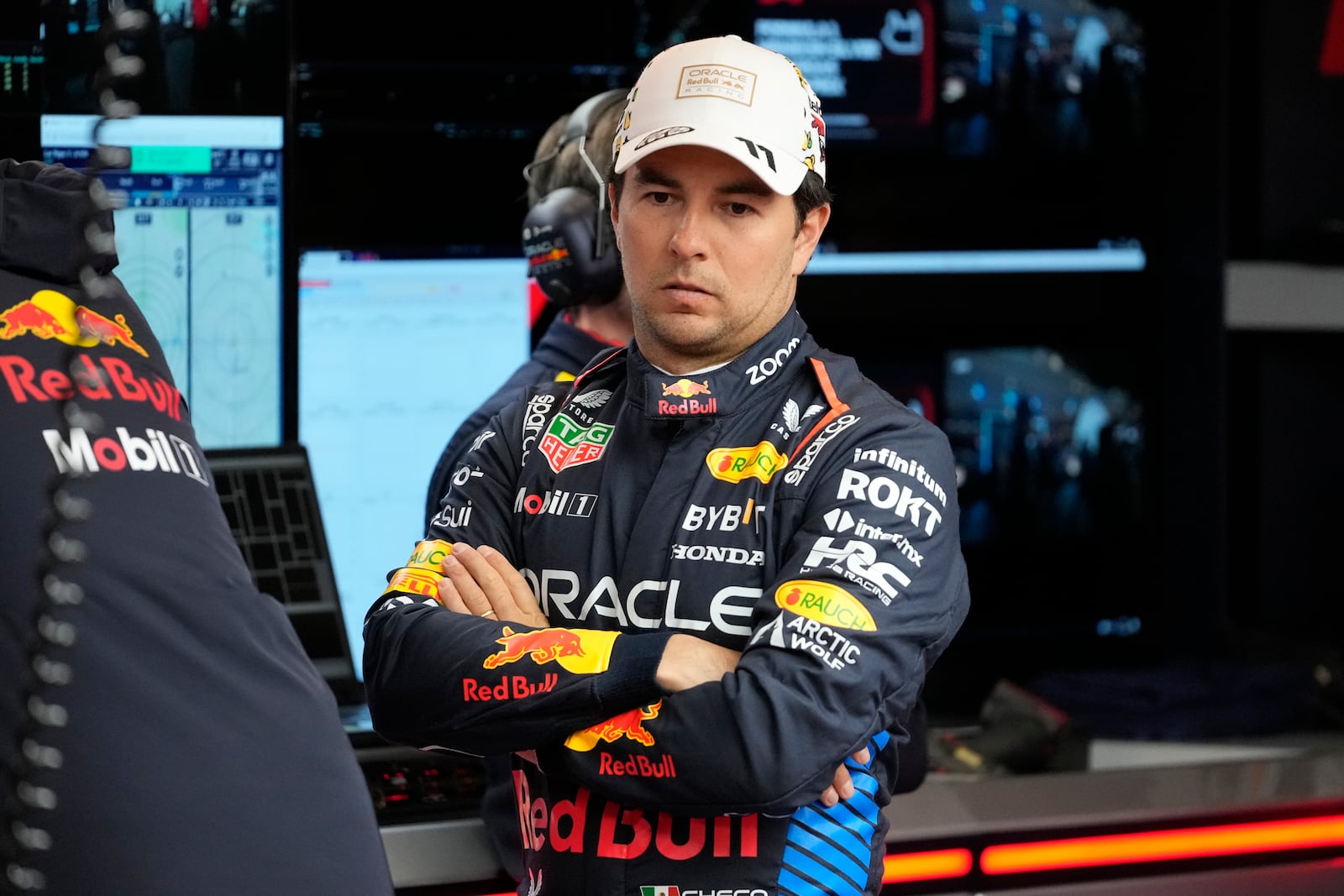 FILE - Red Bull driver Sergio Perez, of Mexico, waits in the garage area prior to a practice session for the Formula One U.S. Grand Prix auto race, Thursday, Nov. 21, 2024, in Las Vegas. (AP Photo/Matt York, File)