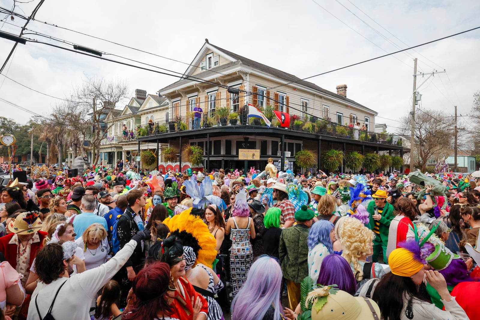 People gather outside R Bar during Mardi Gras in New Orleans, Tuesday, March 4, 2025. (Sophia Germer/The Times-Picayune/The New Orleans Advocate via AP)