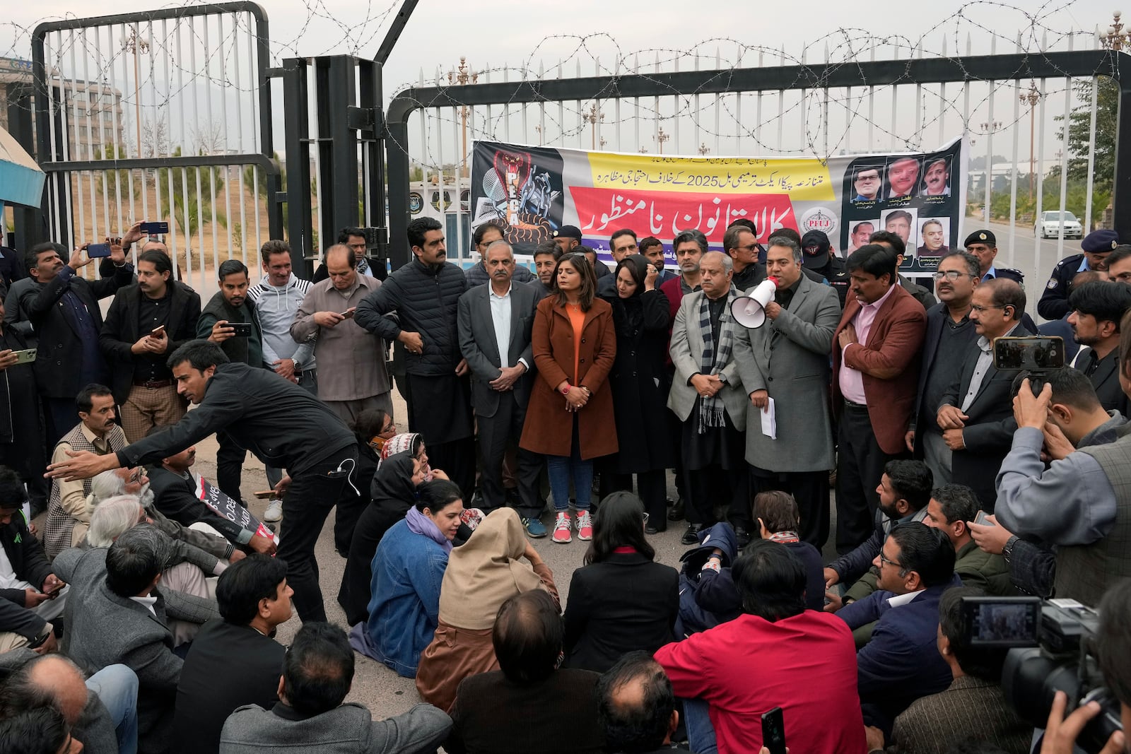 Journalists take part in a protest rally in Islamabad, Pakistan, Tuesday, Jan. 28, 2025, to condemn a controversial 'Prevention of Electronic Crimes Act' bill passed by parliament that critics argue is designed to suppress freedom of speech. (AP Photo/Anjum Naveed)