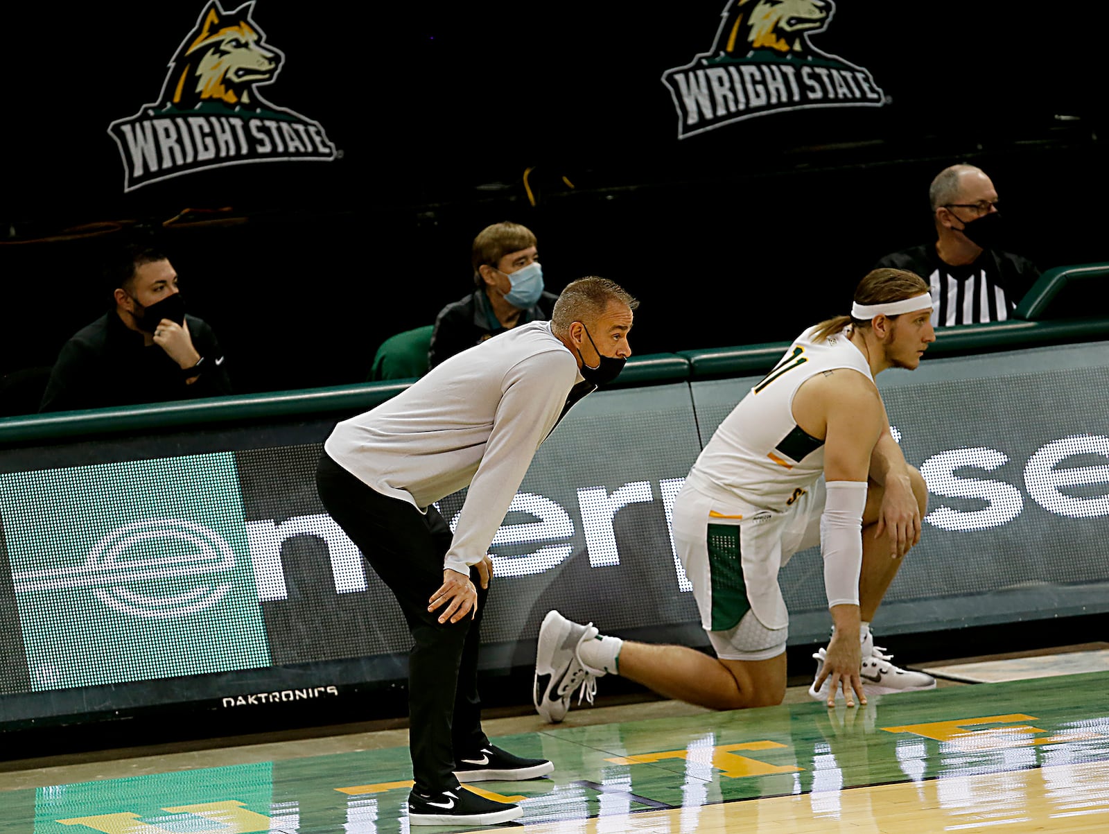 Wright State head coach Scott Nagy, center, watches the action against Green Bay as center Loudon Love waits to reenter during a men's basketball game at the Nutter Center in Fairborn Saturday, Dec. 26, 2020. E.L. Hubbard/CONTRIBUTED