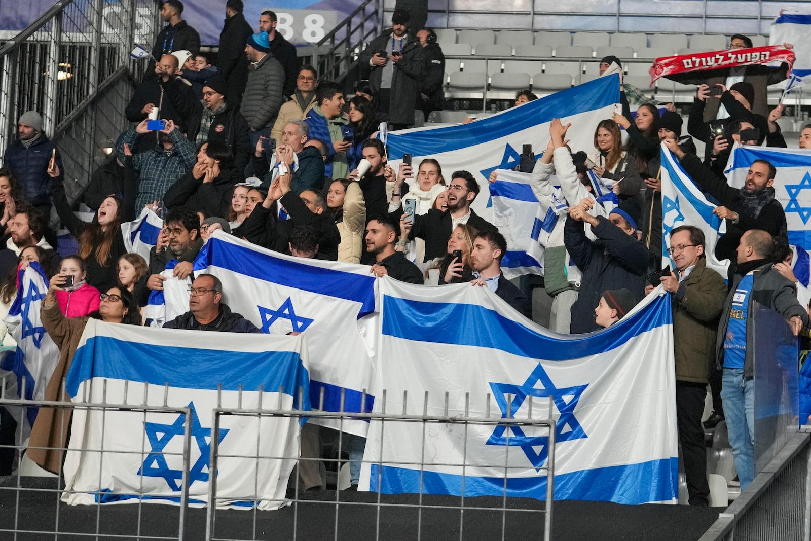 Israel supporters react following the UEFA Nations League soccer match between France and Israel at the Sea de de France stadium in Saint-Denis, outside Paris, Thursday Nov. 14, 2024. (AP Photo/Michel Euler)