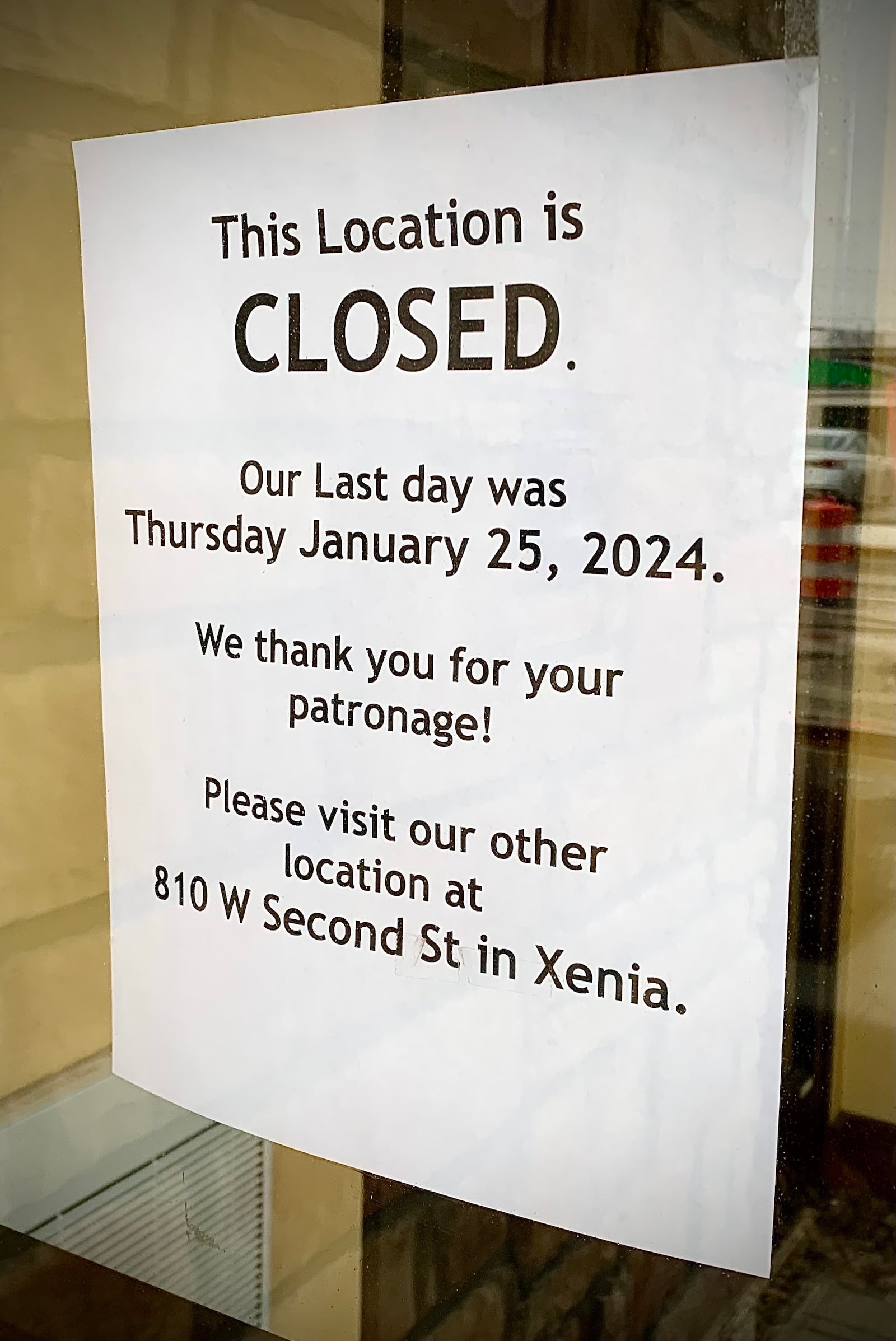 A sign posted to the door at Tudor's Biscuit World in Fairborn directs customers to the nearest location in Xenia. MARSHALL GORBY\STAFF