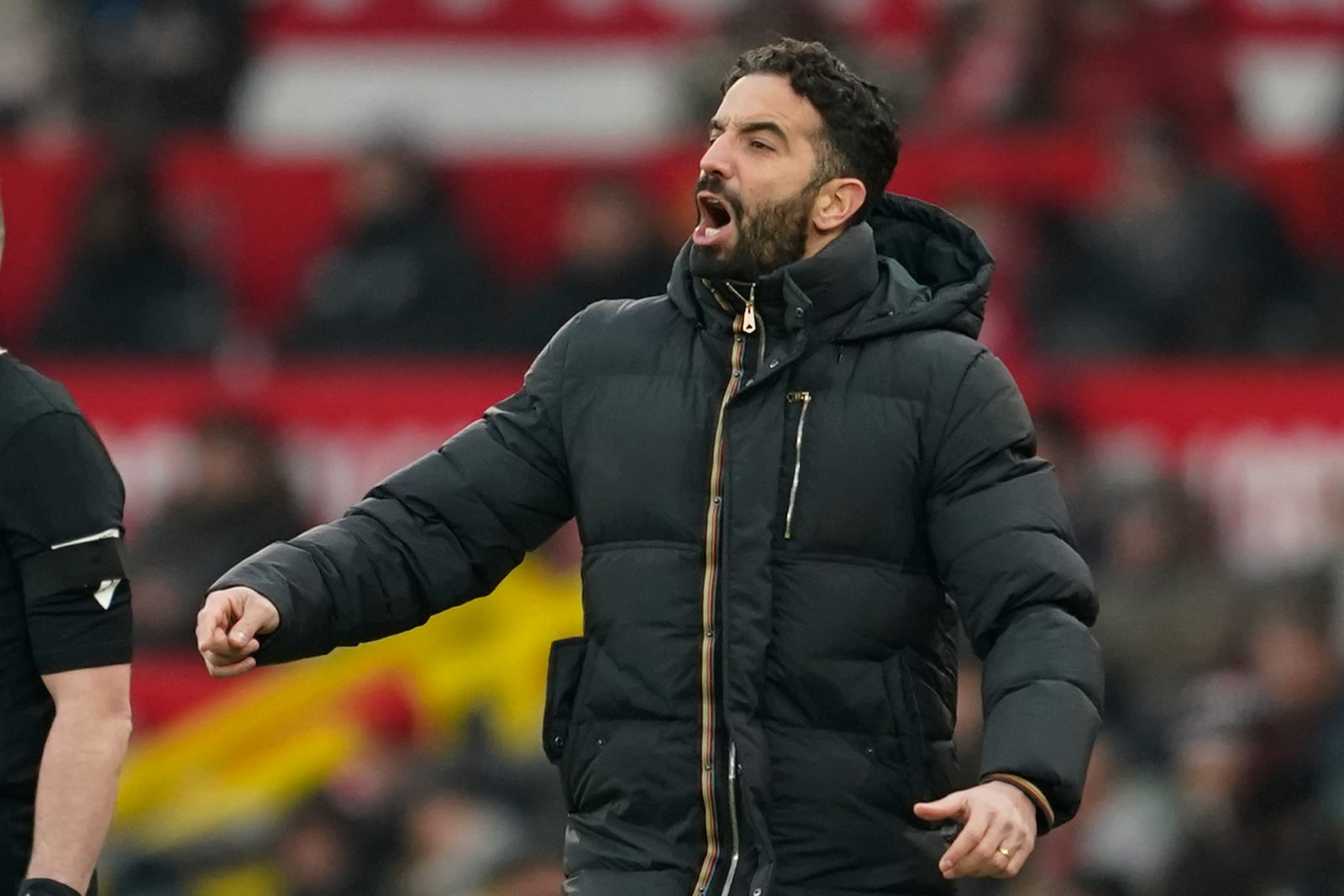 Manchester United's head coach Ruben Amorim follows the game during the English Premier League soccer match between Manchester United and Brighton and Hove Albion, at the Old Trafford stadium in Manchester, England, Sunday, Jan. 19, 2025. (AP Photo/Dave Thompson)