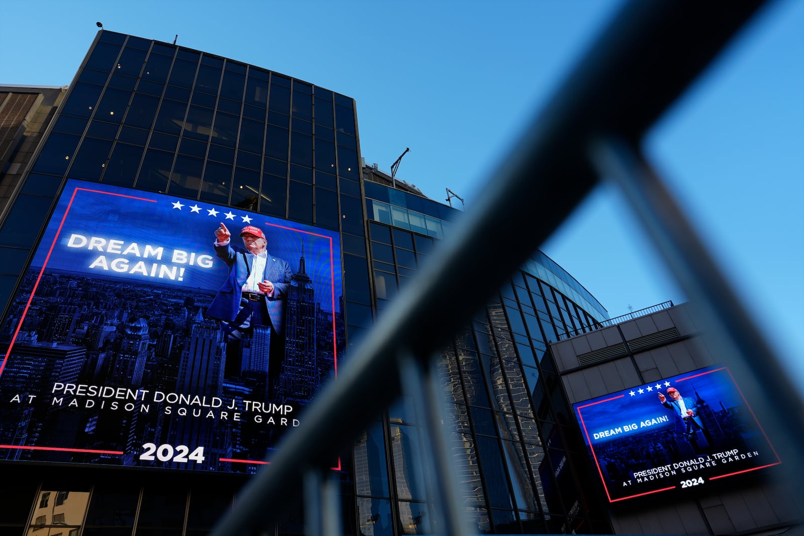 Video boards outside Madison Square Garden display information about the campaign rally for Republican presidential nominee former President Donald Trump Sunday, Oct. 27, 2024, in New York. (AP Photo/Julia Demaree Nikhinson)