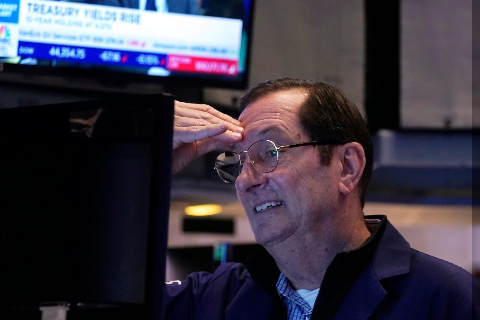 Trader William O'Keefe works on the floor of the New York Stock Exchange, Tuesday, Feb. 4, 2025. (AP Photo/Richard Drew)