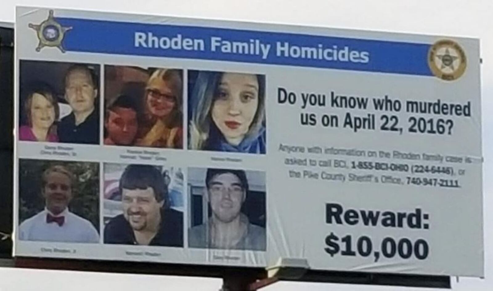 Crews installed a billboard on Ohio  23 north in Waverly, near the Pike County Sheriff's Office, in advance of the one-year anniversary of the Rhoden family murders on April 22, 2016. The billboard promotes the $10,000 reward for information leading to a conviction in the eight unsolved homicides. The billboard company donated the space, and Sheriff Charles Reader used Furtherance of Justice funds from his office to cover the cost. Holly Zachariah /The Columbus Dispatch