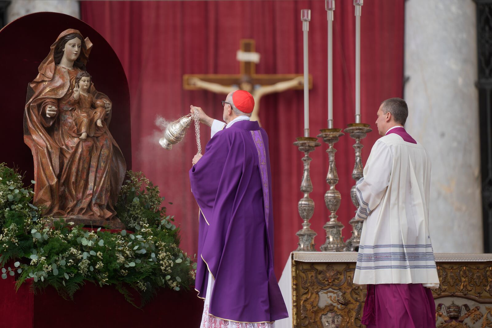 Cardinal Michael Czerny, prefect of the Dicastery for Promoting Integral Human Development, and delegate of Pope Francis celebrates a mass for the members of the world of volunteers in St. Peter's Square at The Vatican, Sunday, March 9, 2025. (AP Photo/Gregorio Borgia)