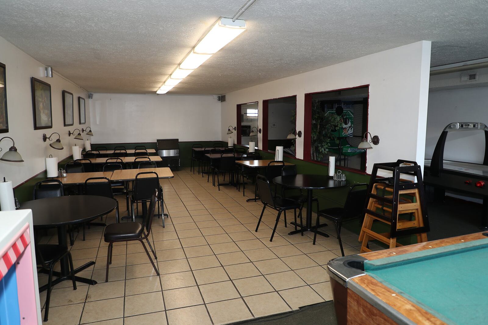 The dining room at Slice of Heaven Pizzeria has space for about 40 customers. BILL LACKEY/STAFF