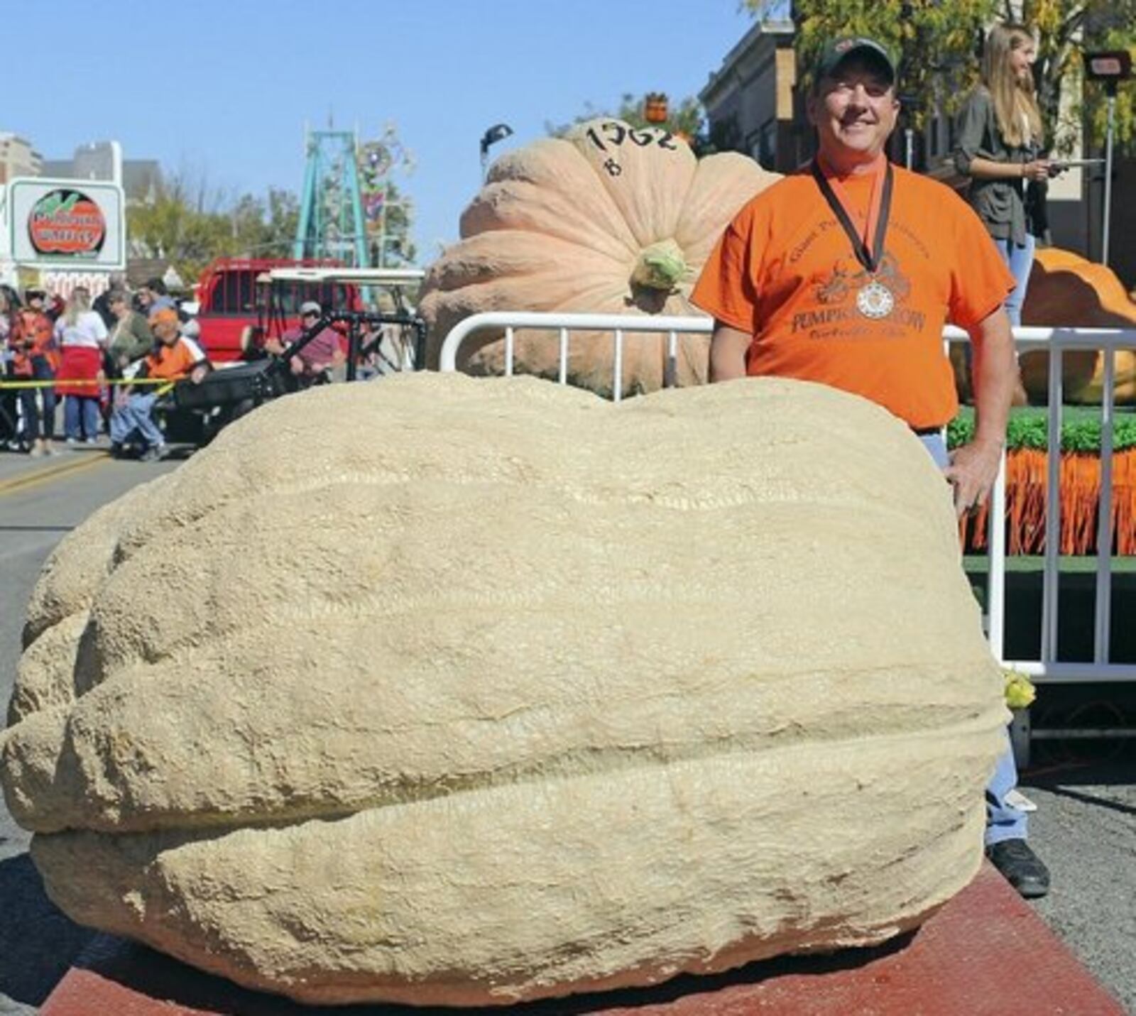 Cecil Weston stands in front of his pumpkin, which weighed in at 1,701 pounds. This is Weston's final year to compete as he's moving to Michigan in 2018. THE COLUMBUS DISPATCH