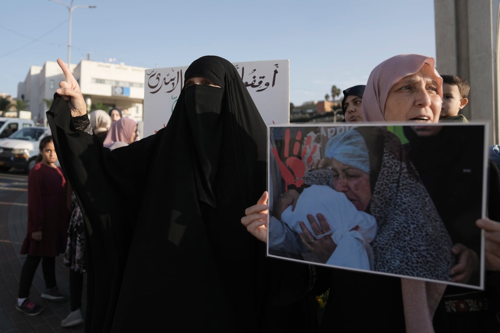 Palestinian citizens of Israel protest against Israel's military operations in the Gaza Strip and Lebanon, in Umm Al-Fahm, Israel, Saturday, Nov. 9, 2024. (AP Photo/Mahmoud Illean)