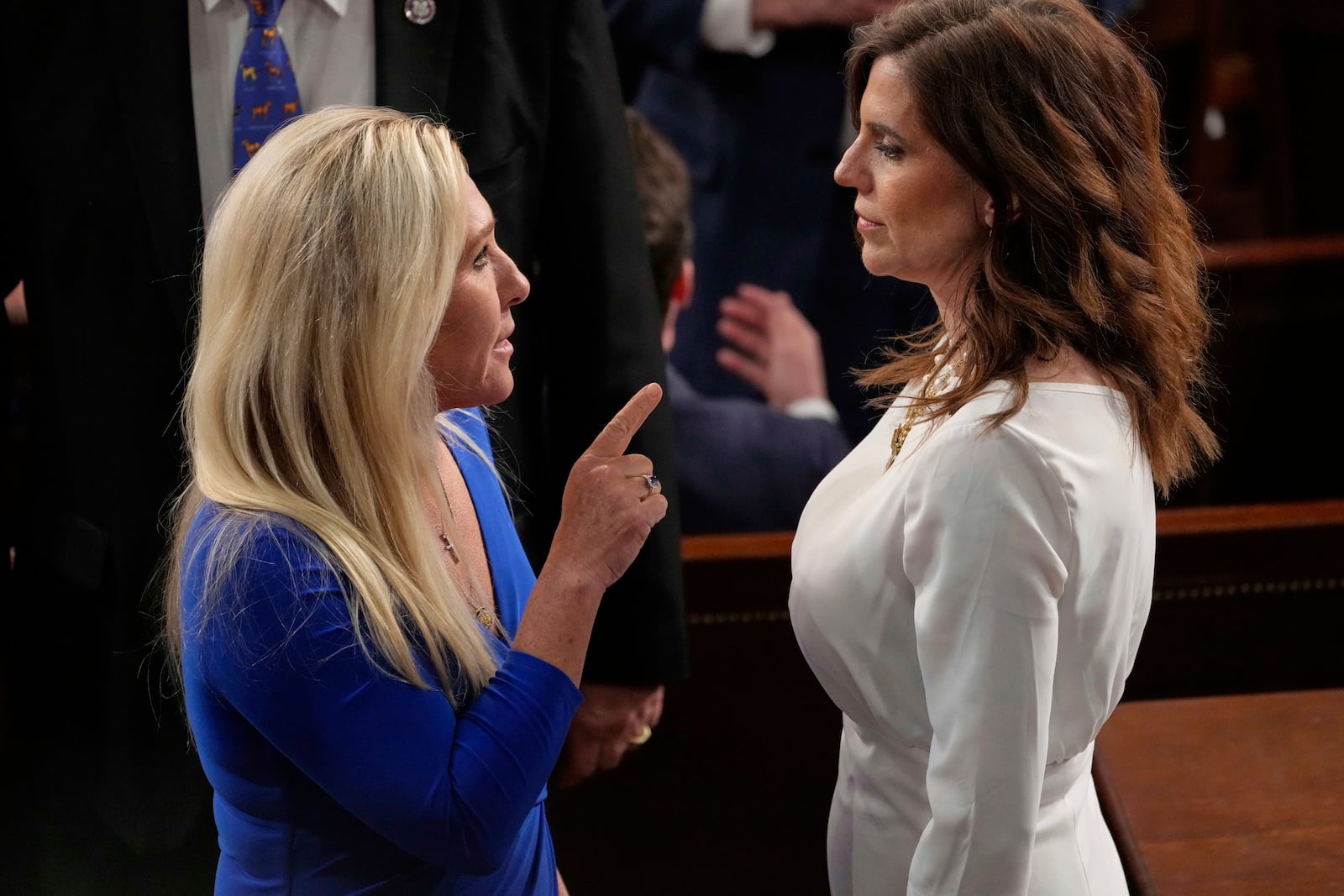 Rep. Marjorie Taylor Greene, R-Ga., talks with Rep. Nancy Mace, R-S.C., right, before President Donald Trump addresses a joint session of Congress in the House chamber at the U.S. Capitol in Washington, Tuesday, March 4, 2025. (AP Photo/Julia Demaree Nikhinson)