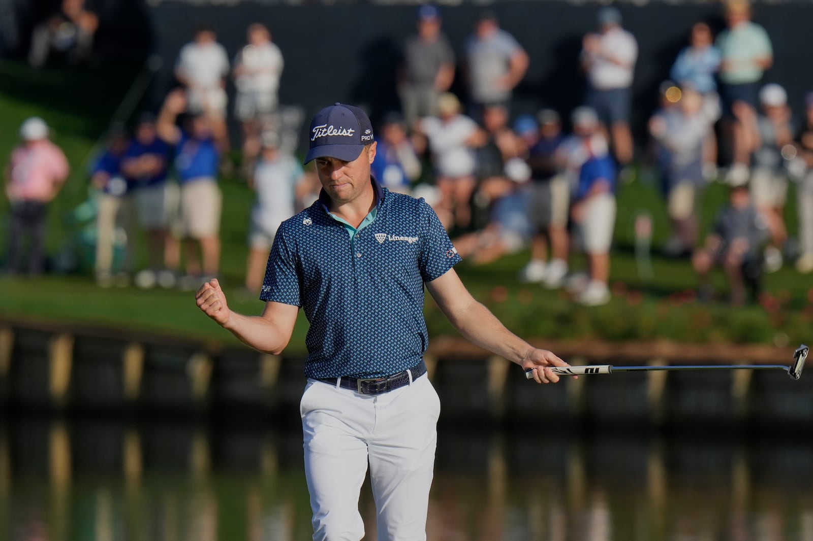 Justin Thomas celebrates after making a birdie on the 17th hole during the second round of The Players Championship golf tournament Friday, March 14, 2025, in Ponte Vedra Beach, Fla. (AP Photo/Chris O'Meara)