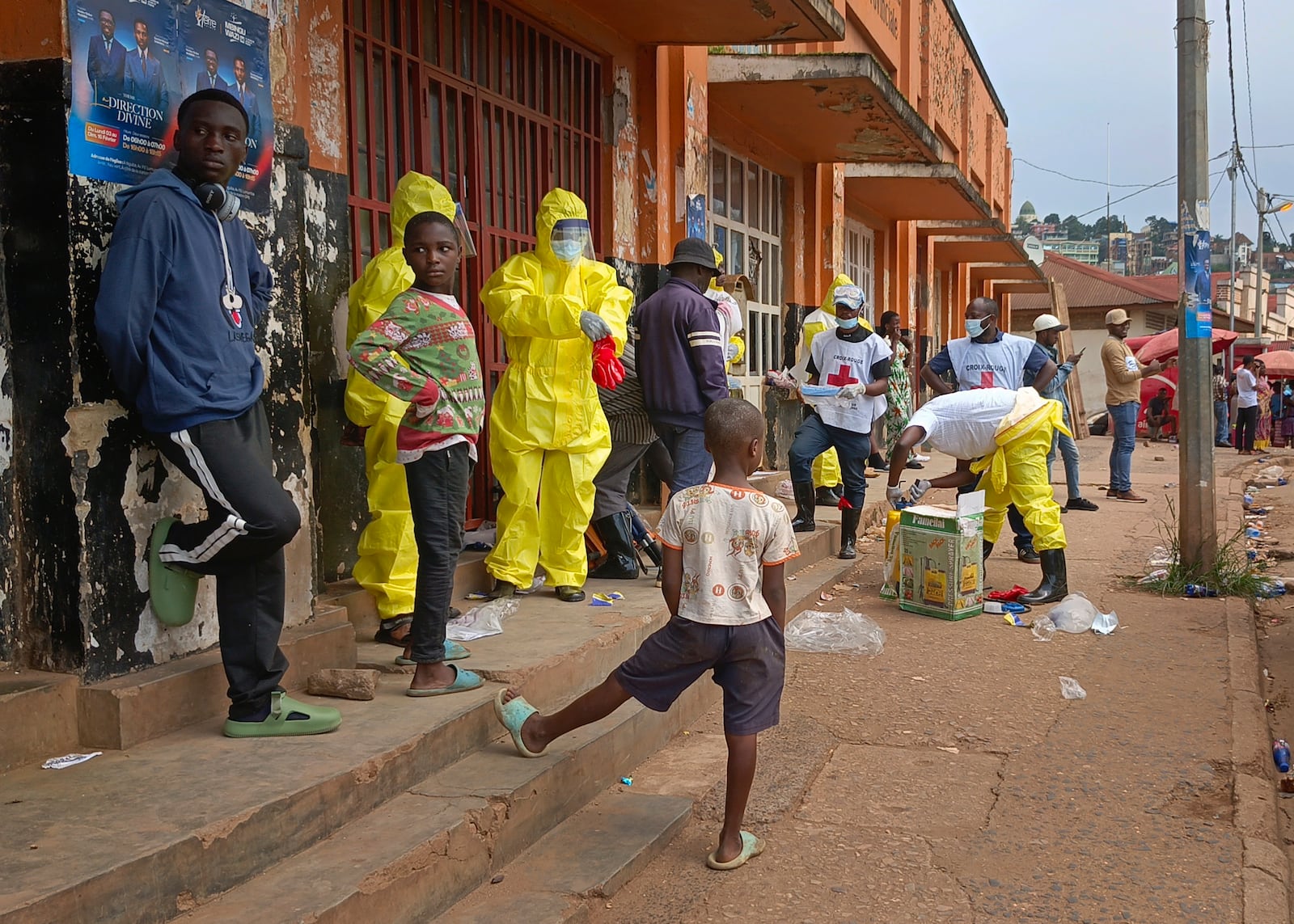 Red Cross workers collect the remains of a dead person in east Congo's second-largest city, Bukavu, one day after it was taken by M23 rebels, Monday, Feb. 17, 2025. (AP Photo/Janvier Barhahiga)