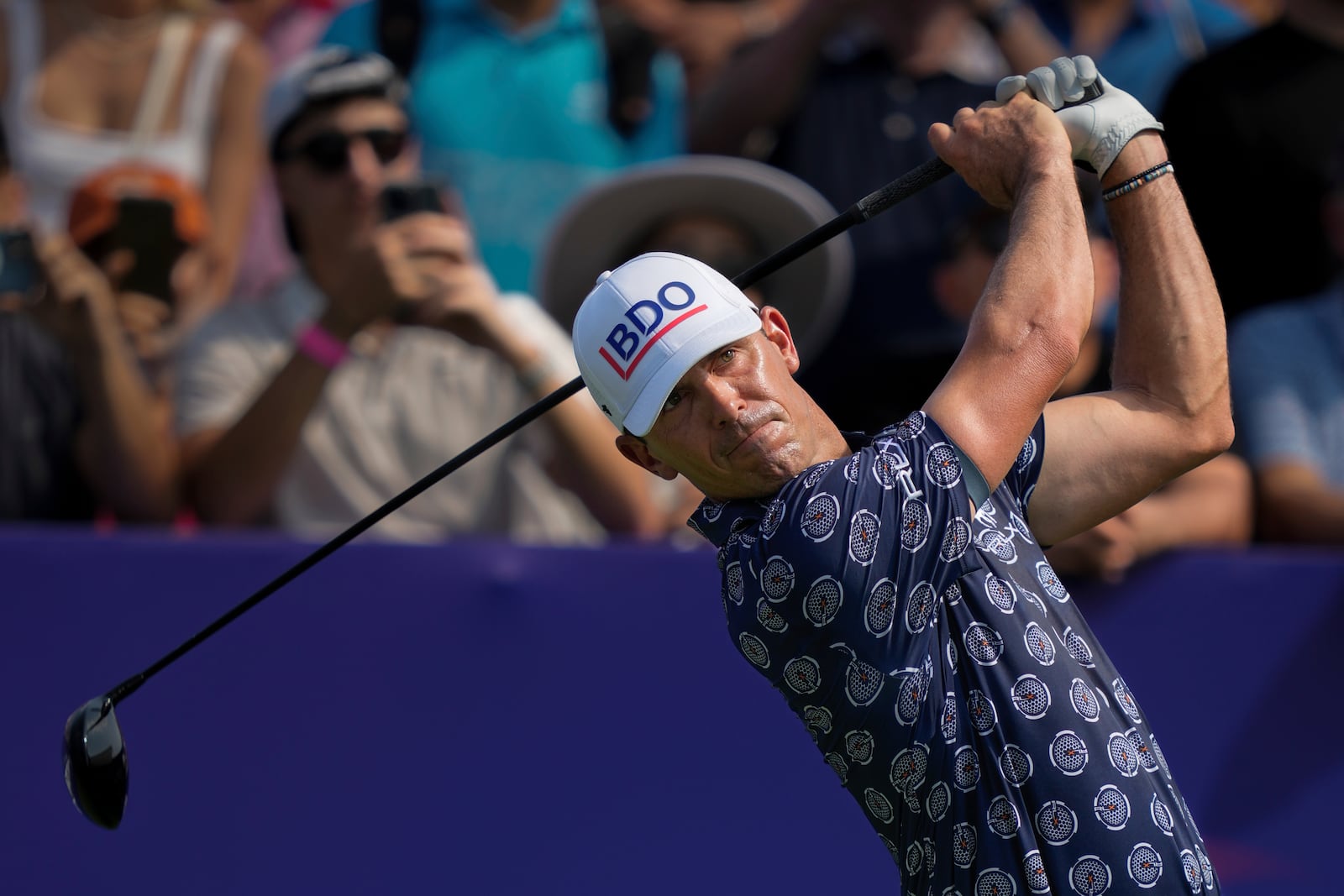 Billy Horschel of the United States hits off the first tee during the first round of World Tour Golf Championship in Dubai, United Arab Emirates, Thursday, Nov. 14, 2024. (AP Photo/Altaf Qadri)