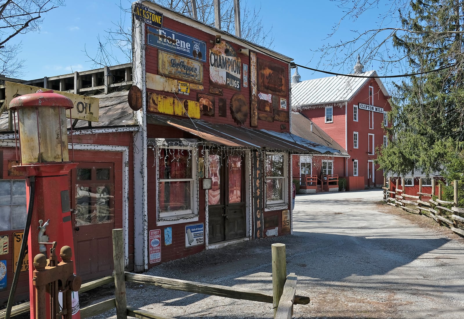 The village of Clifton, home to historic Clifton Mill, will host the Ohio Chautauqua showing the water falls and a different shot with an old gas station. BILL LACKEY/STAFF