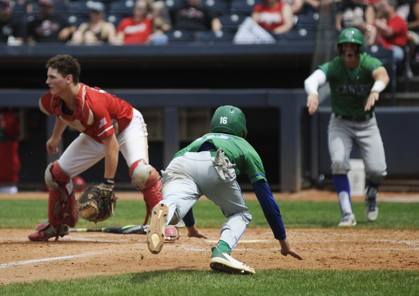 Chaminade Julienne senior Nick Wissman scores in the fifth inning. CJ defeated Van Wert 6-1 in a high school baseball D-II state semifinal at Canal Park in Akron on Saturday, June 8, 2019. MARC PENDLETON / STAFF