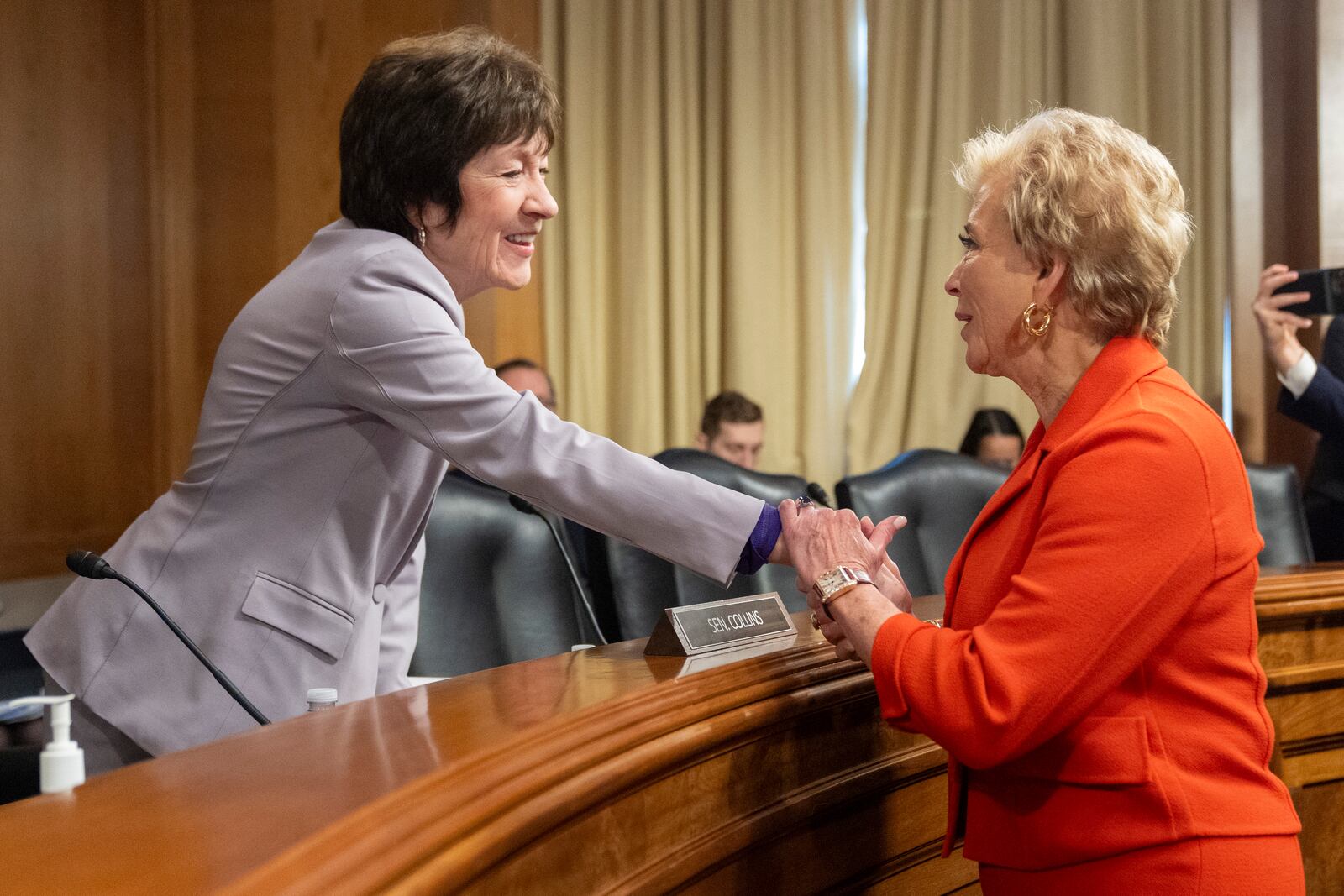 Sen. Susan Collins, R-Maine, left, greets Linda McMahon, President Donald Trump's nominee for Secretary of Education, at the start of a hearing of the Health, Education, and Labor Committee on McMahon's nomination, Thursday, Feb. 13, 2025, in Washington. (AP Photo/Jacquelyn Martin)