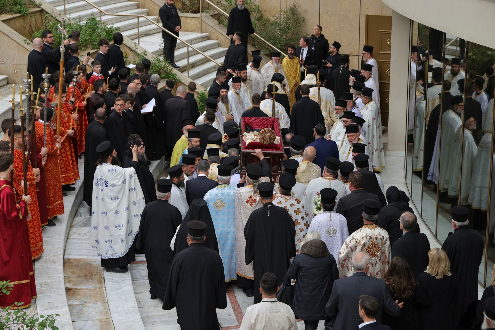 Priests carry the coffin of the late Archbishop Anastasios of Tirana, Durres and All Albania, during his funeral inside the Cathedral of the Resurrection of Christ, in Tirana, Albania, Thursday, Jan. 30, 2025. (AP Photo/Vlasov Sulaj)