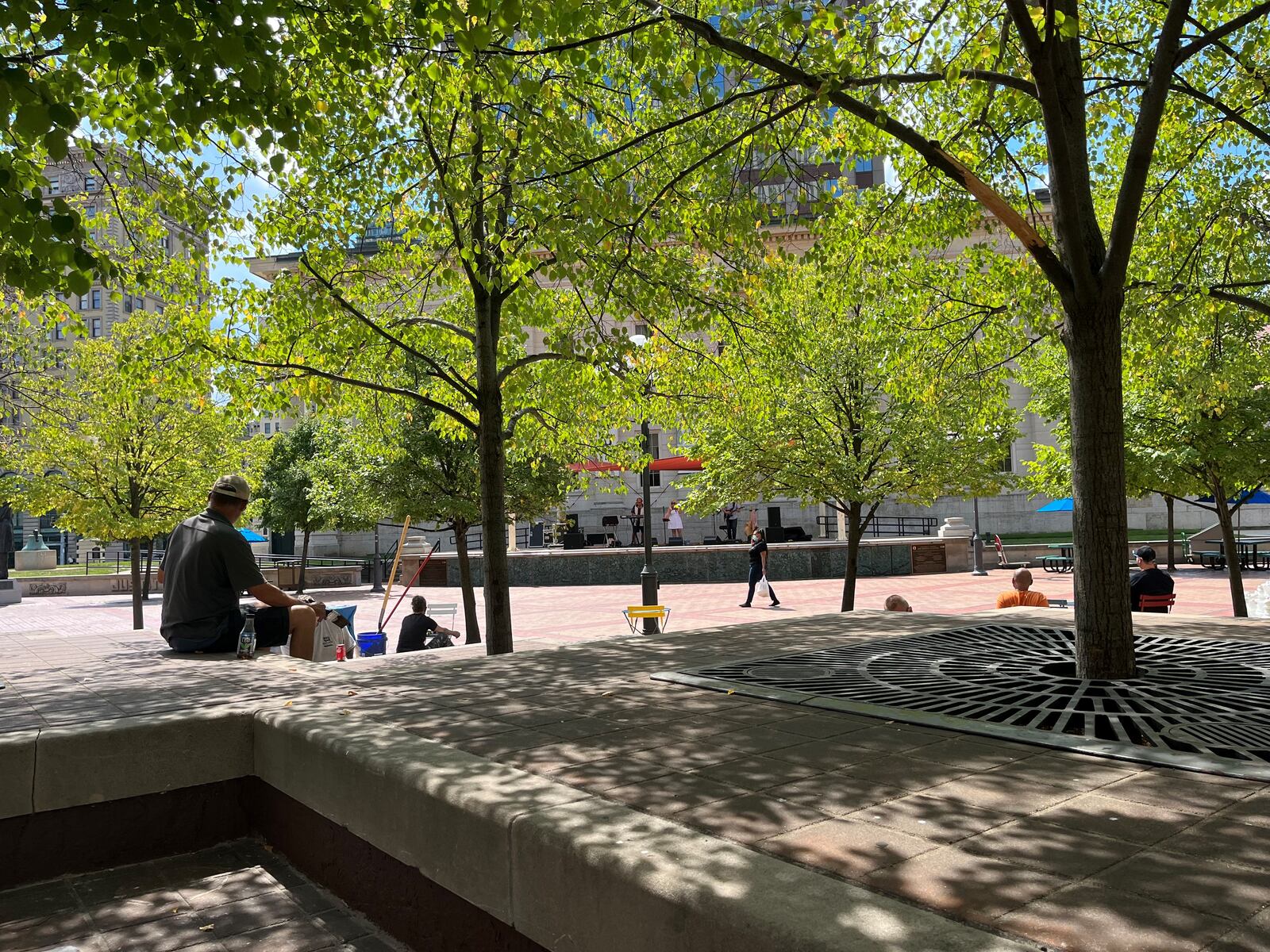 People gather on the terrace seating at Courthouse Square at lunchtime on Friday. CORNELIUS FROLIK / STAFF