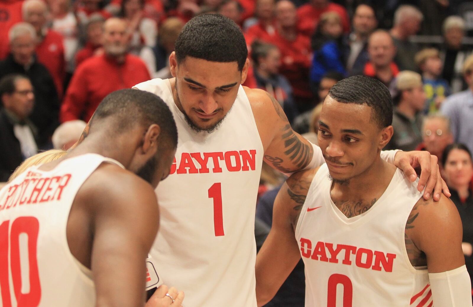 Dayton’s Rodney Chatman (right), Obi Toppin (center) and Jalen Crutcher against Davidson on Friday, Feb. 28, 2020, at UD Arena. David Jablonski/Staff