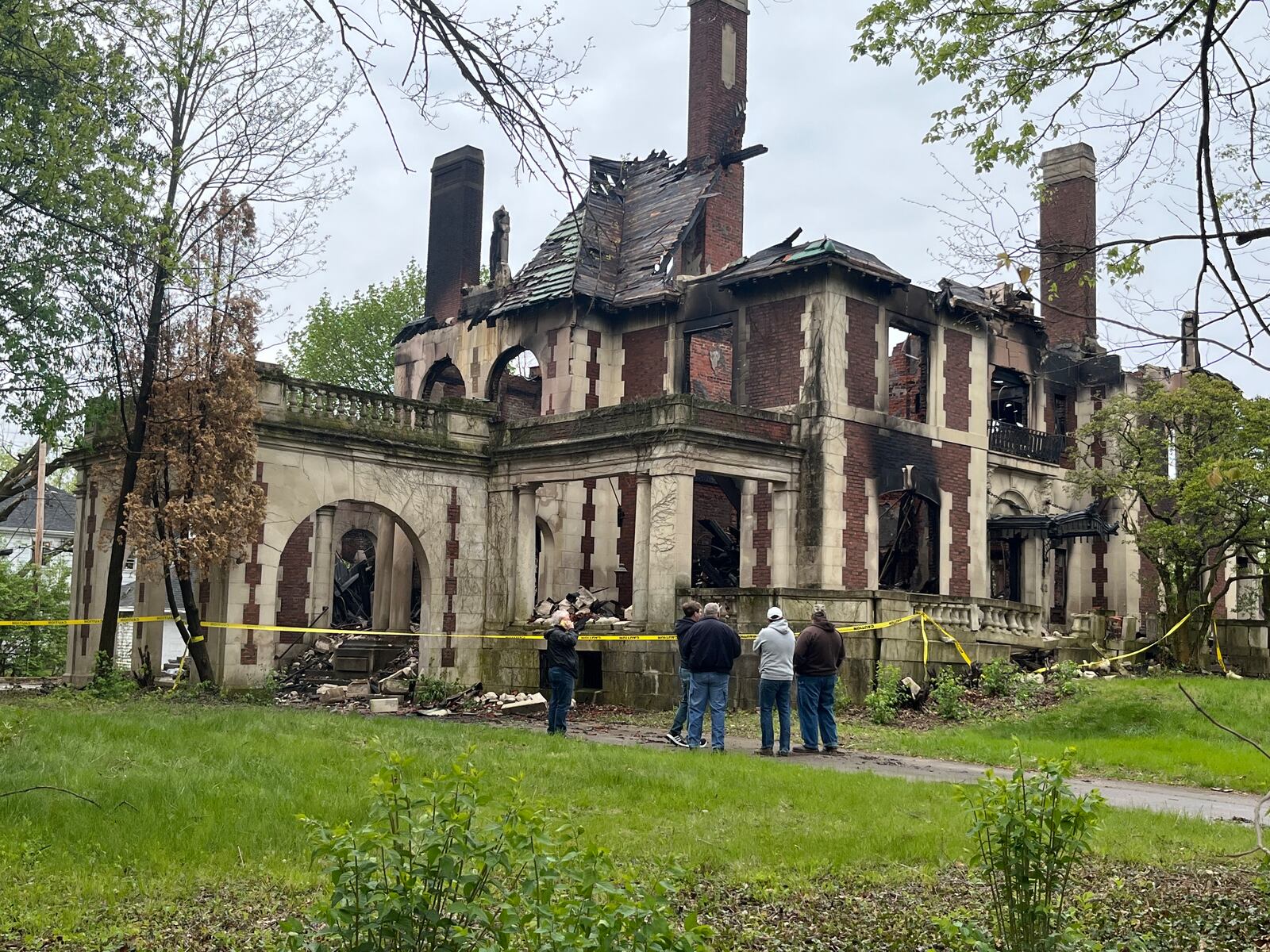 Representatives of the city of Dayton and the history group Preservation Dayton discuss the fire at the Traxler Mansion at the corner of Broadway and Yale in West Dayton on Sunday, April 23, 2023. JEREMY P. KELLEY / STAFF