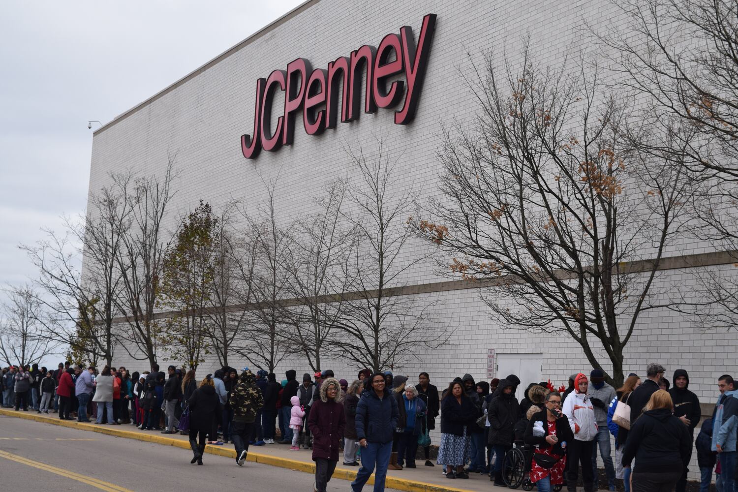 PHOTOS: Hundreds like up outside JCPenney for doorbusters, coupons