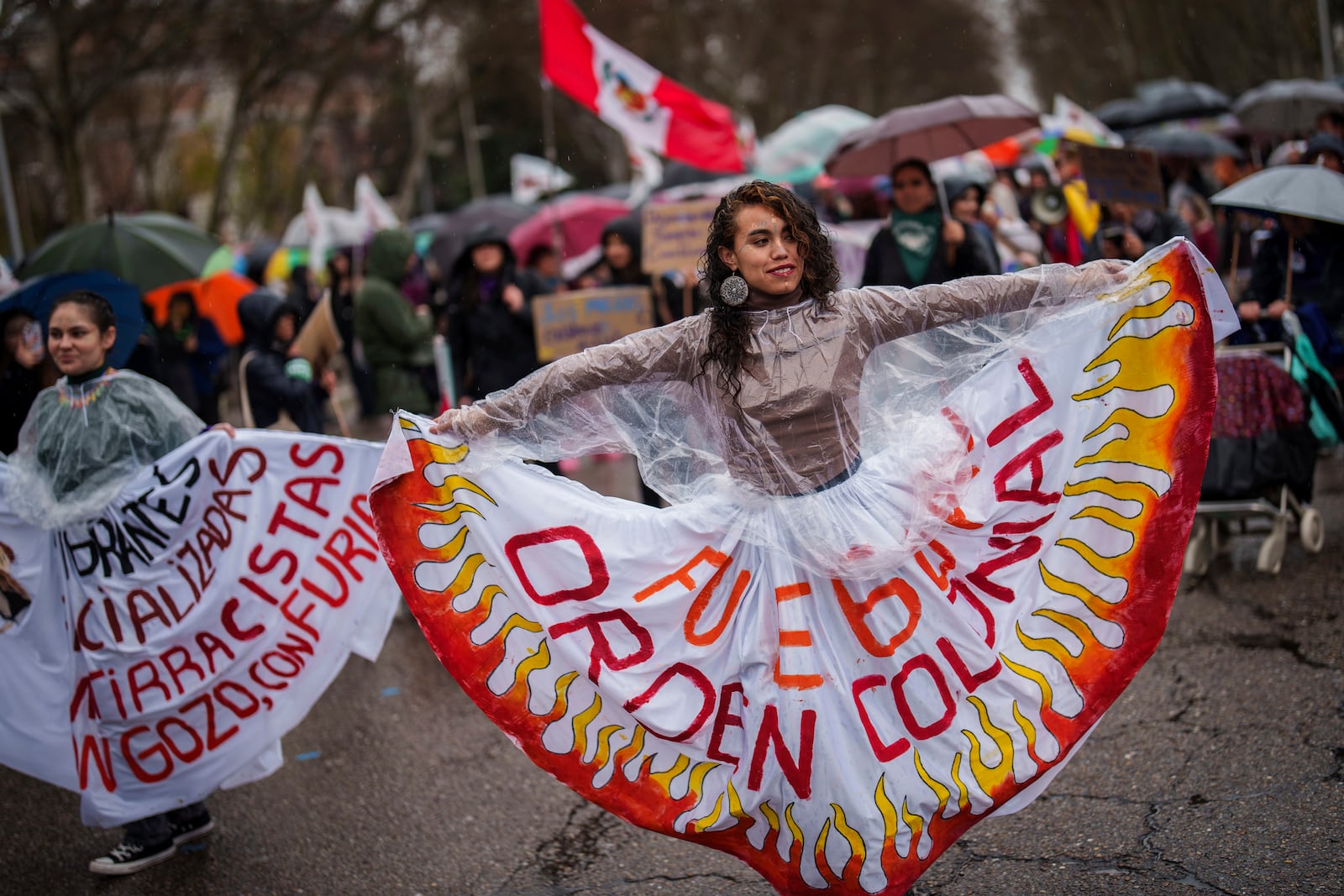 Demonstrators rally during an International Women's Day protest in Madrid, Spain, Saturday, March 8, 2025. (AP Photo/Bernat Armangue)