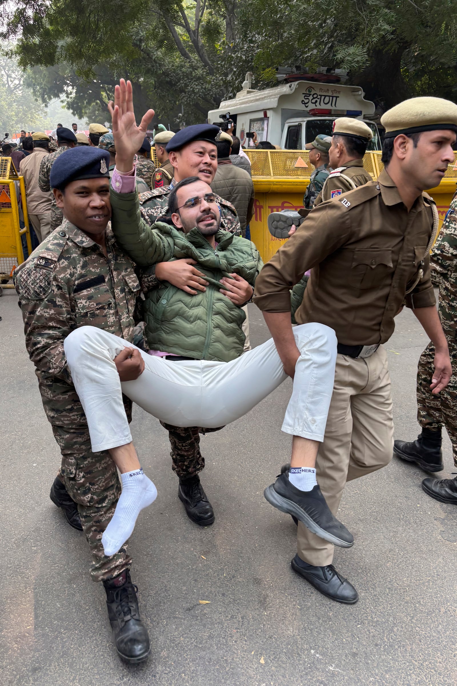 Police detain a Congress party supporter participating during a protest against Indian billionaire Gautam Adani and Indian Prime Minister Narendra Modi, after Adani was indicted by U.S. prosecutors for bribery and fraud, in New Delhi, India, Monday, Nov. 25, 2024. (AP Photo/Shonal Ganguly)