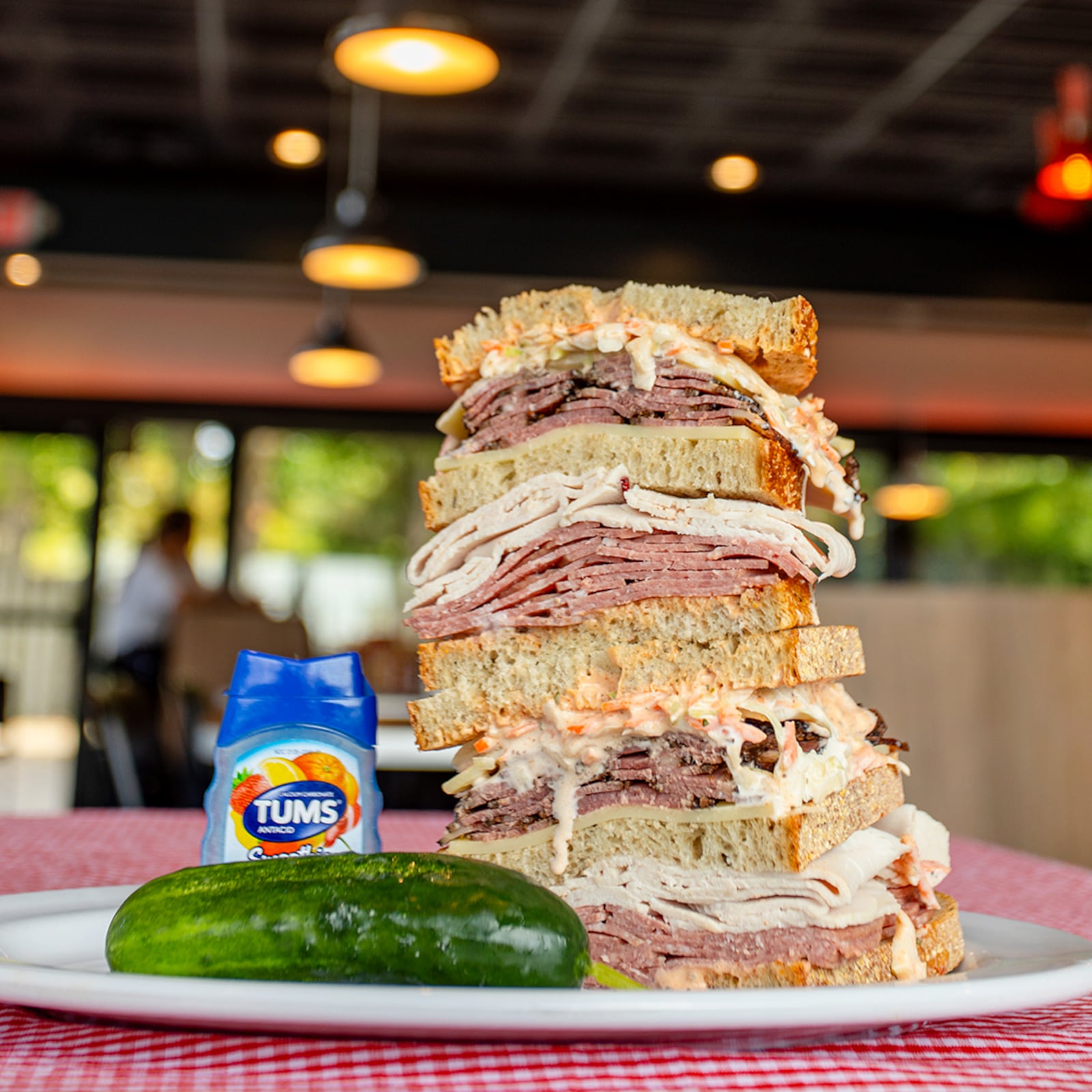 Four football players from The Ohio State University will go head-to-head to see who can eat All The Best Delicatessen’s secret menu item, “The Stupid-Big Sandwich,” in the fastest time on Monday, Oct. 9 at 3:30 p.m. (CONTRIBUTED PHOTO).