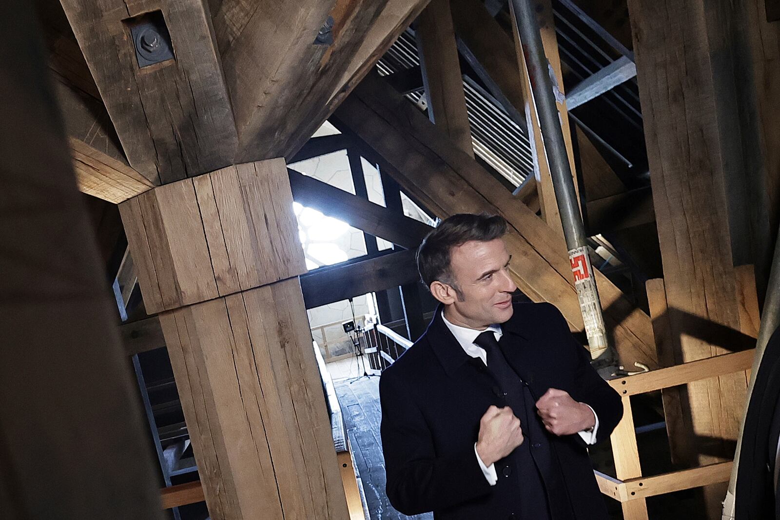 French President Emmanuel Macron gestures as he visits the restored interiors of the Notre-Dame de Paris cathedral, Friday, Nov.29, 2024 in Paris. (Christophe Petit Tesson, Pool via AP)