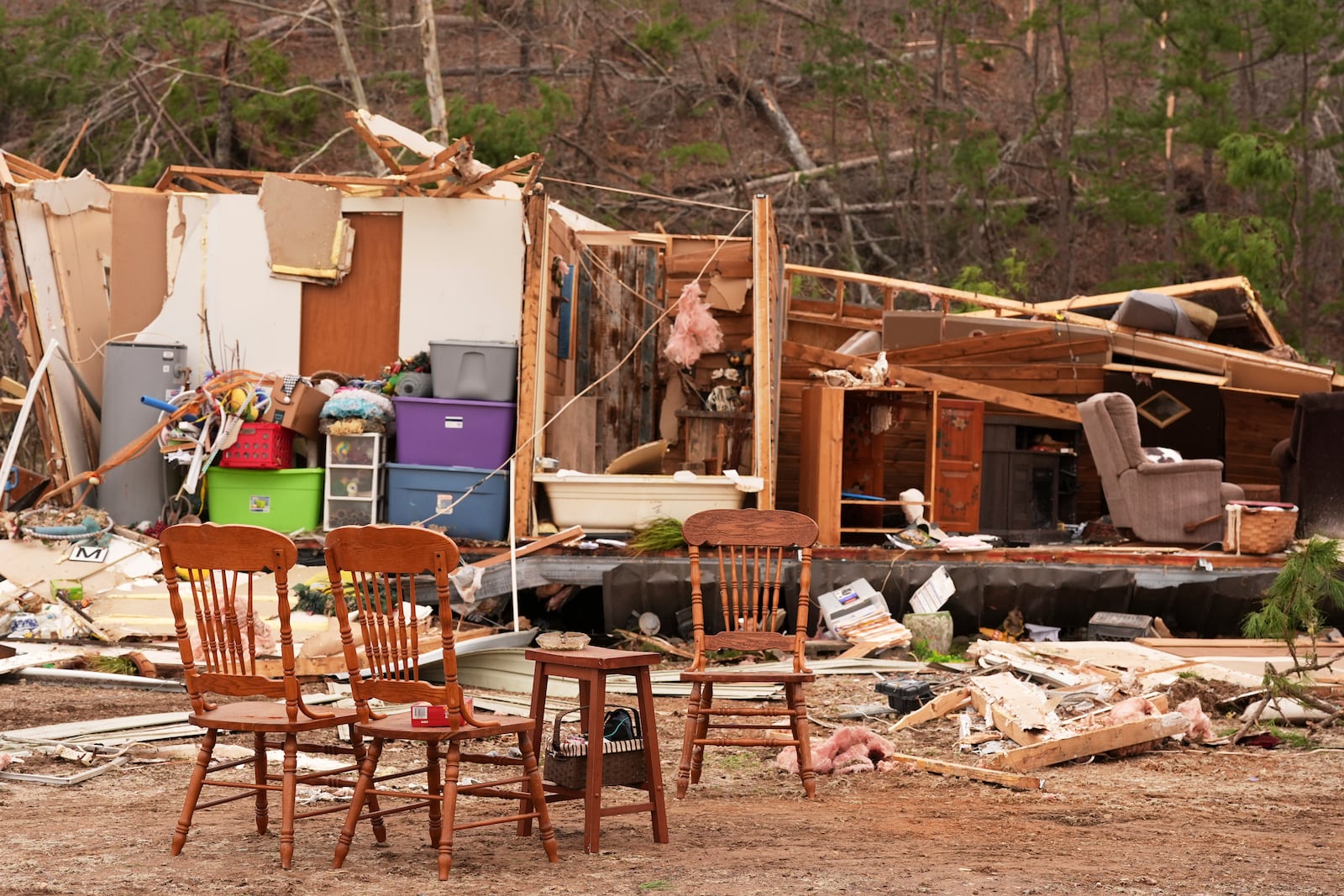 A home is destroyed after a severe storm, Saturday, March 15, 2025, in Wayne County, Mo. (AP Photo/Jeff Roberson)