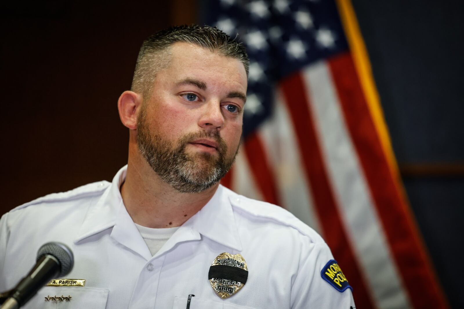 Moraine Police Sgt. Andrew Parish speaks to the media about a shooting at DMAX Thursday night on May 18, 2023. JIM NOELKER/STAFF