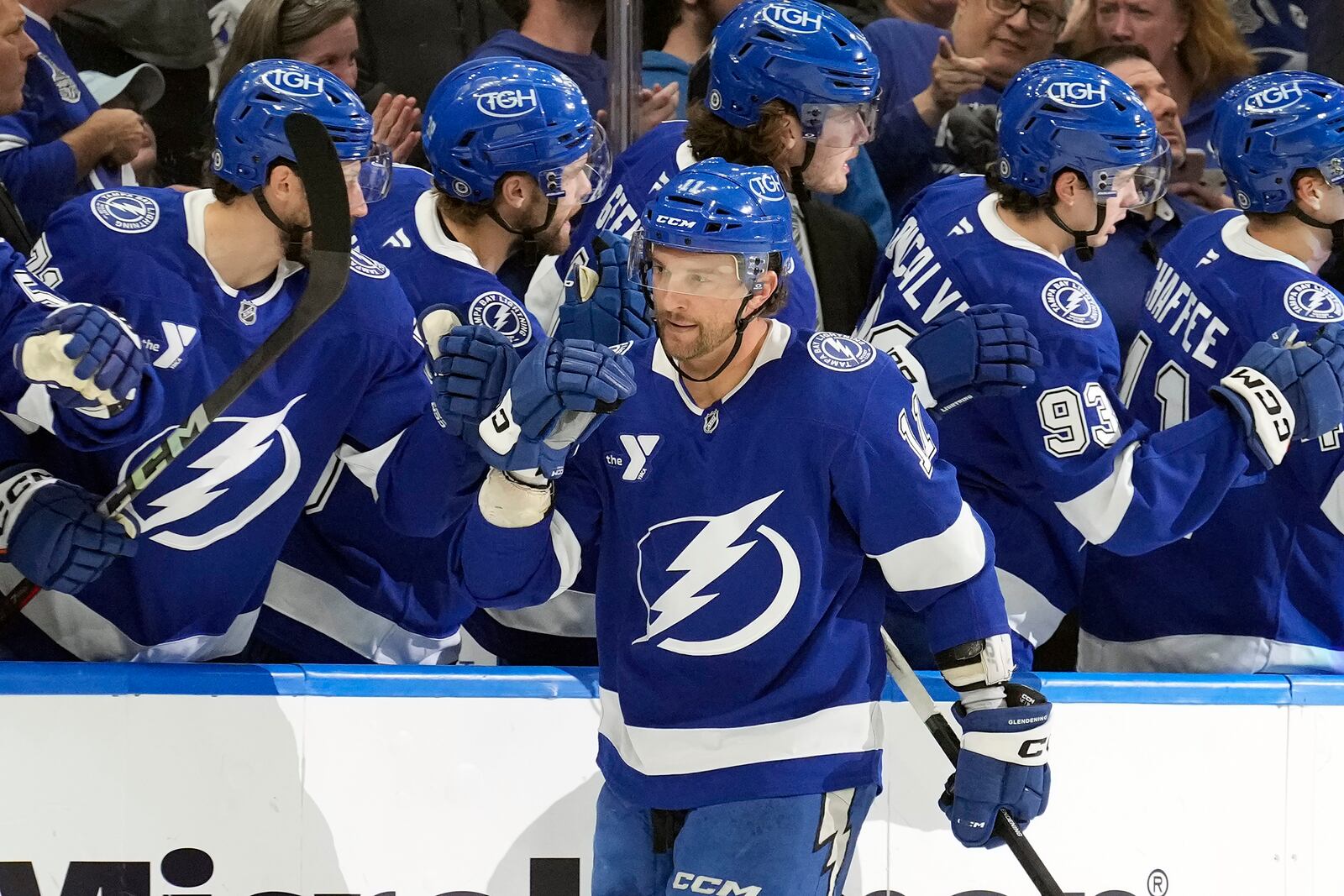 Tampa Bay Lightning center Luke Glendening (11) celebrates with the bench after his goal against the Columbus Blue Jackets during the first period of an NHL hockey game Tuesday, Dec. 17, 2024, in Tampa, Fla. (AP Photo/Chris O'Meara)