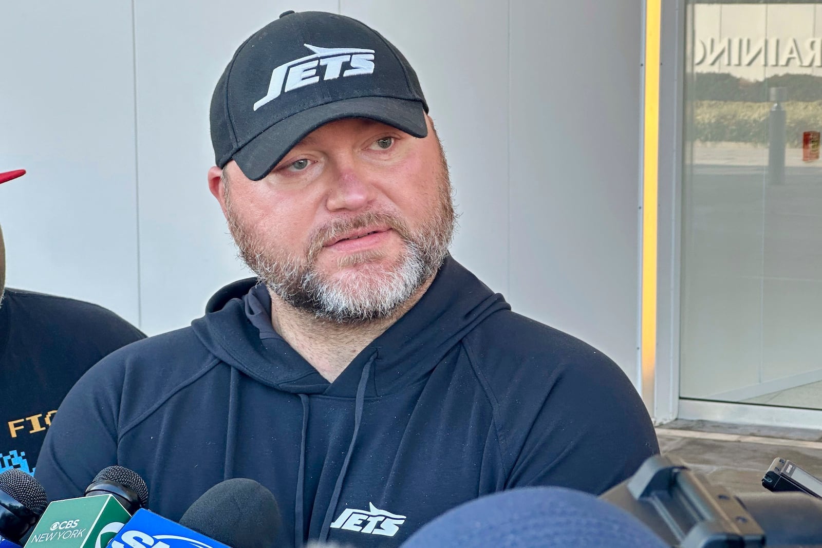 New York Jets general manager Joe Douglas speaks to reporters at the team’s training facility in Florham Park, N.J., on Wednesday, Nov. 6, 2024. (AP Photo/Dennis Waszak Jr.)