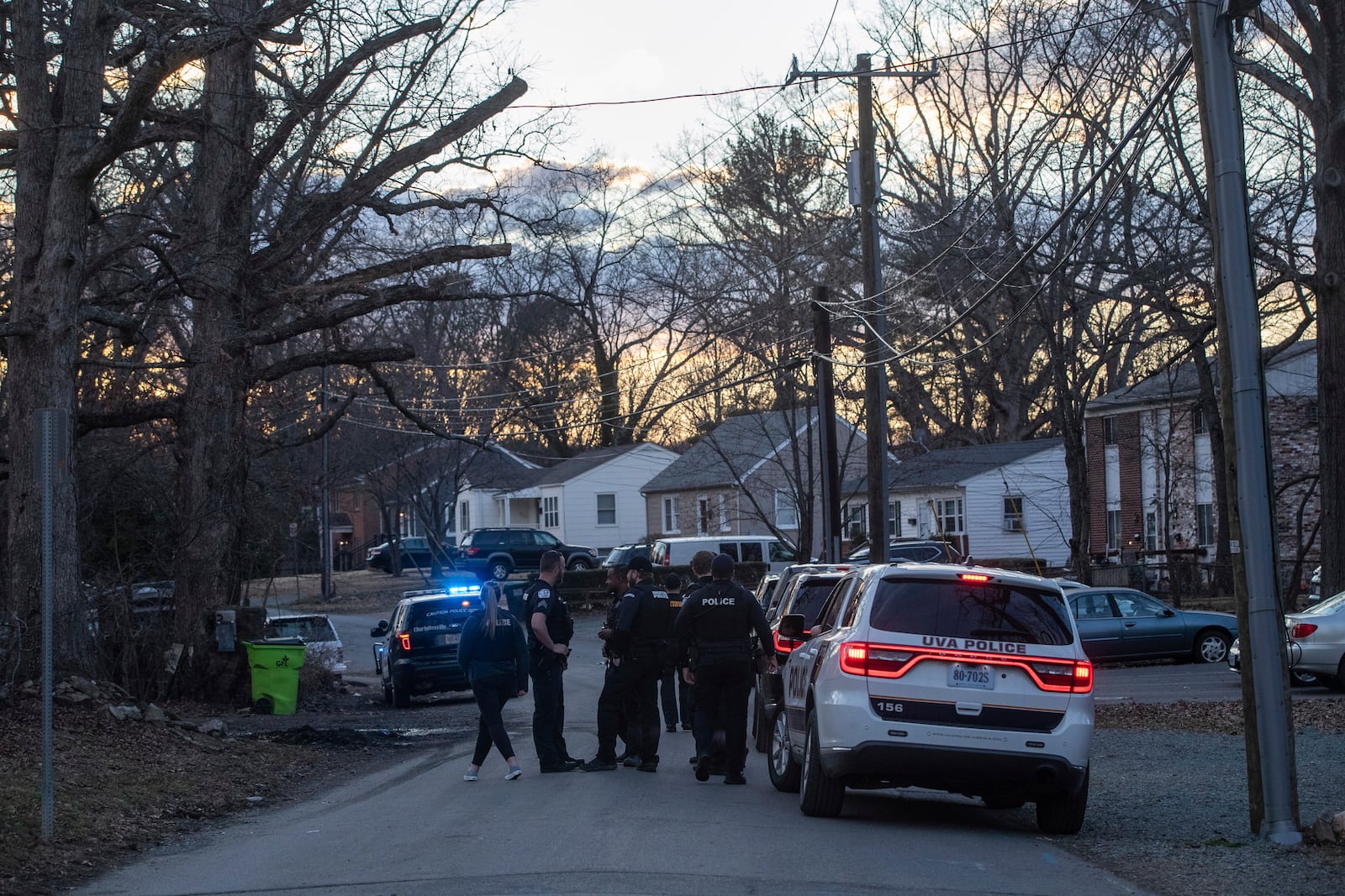 Police walk back to their vehicles after catching and arresting the suspect in the stabbing at on the Grounds of the University of Virginia on Thursday, Feb. 27, 2025. (Cal Cary/The Daily Progress via AP)