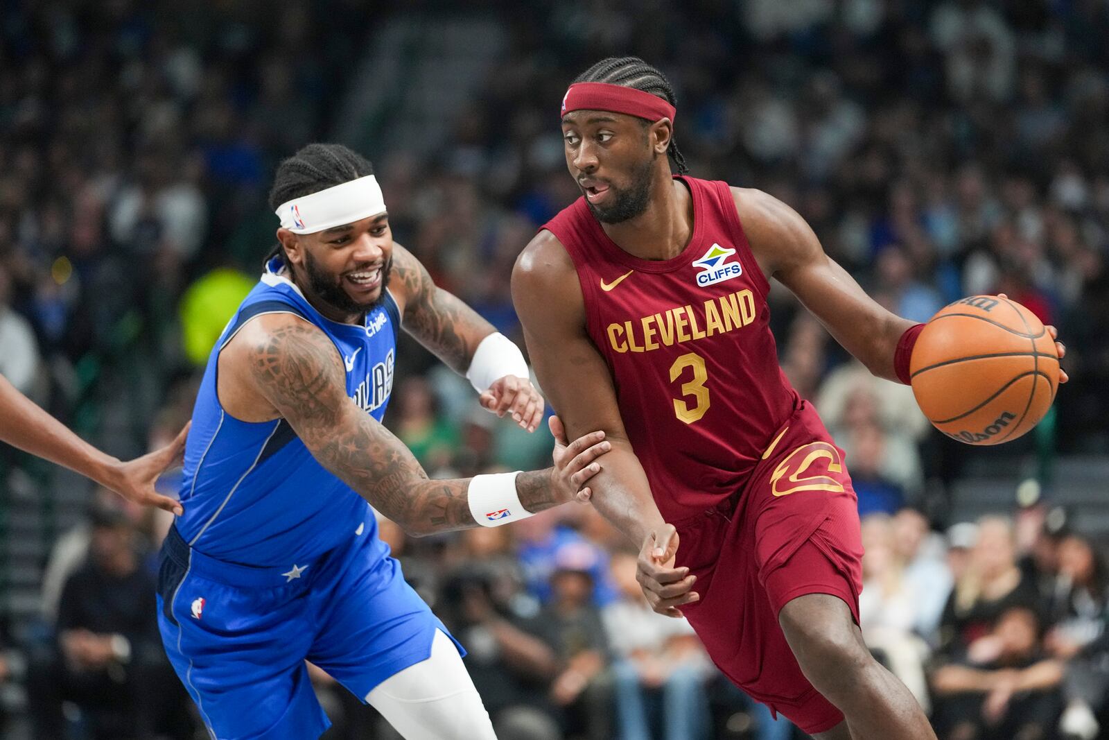 Cleveland Cavaliers guard Caris LeVert (3) drives against Dallas Mavericks guard Jaden Hardy during the first half of an NBA basketball game, Friday, Jan. 3, 2025, in Dallas. (AP Photo/Julio Cortez)