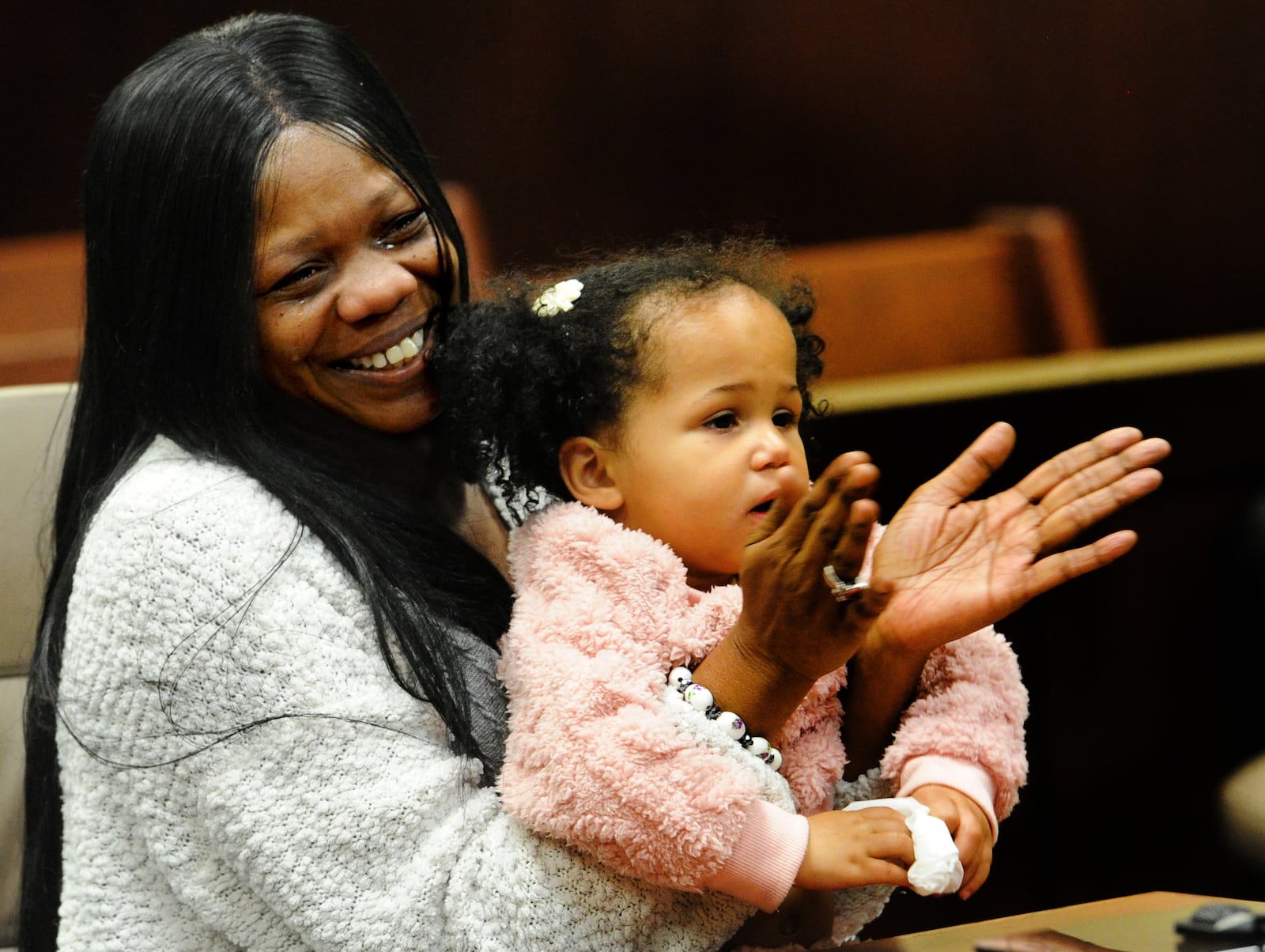 Melissa Oquendo cries after adopting Alaia Oquendo during National Adoption Day Friday Nov. 18, 2022 at the Montgomery County Probate Court. MARSHALL GORBY\STAFF