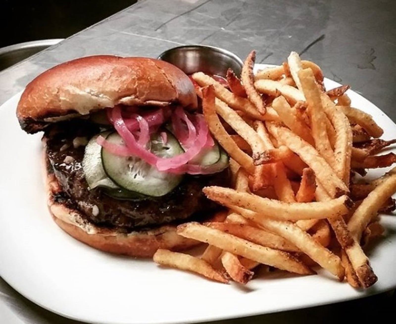 Watermark’s popular (Great) Miami Burger is a half pound of prime Angus reserve beef is grilled pink or not pink and served on a brioche bun and topped with a choice of blue or Ohio cheddar cheese and house pickles and pickled red onion. CONTRIBUTED