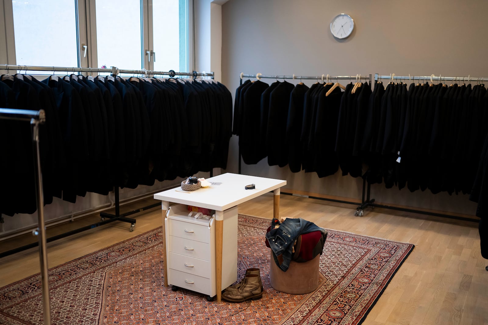 A man's clothes lie in one of the fitting rooms of Lambert Hofer, a renowned costume workshop in Vienna, Austria, Wednesday, Febr 26, 2025. (AP Photo/Denes Erdos)