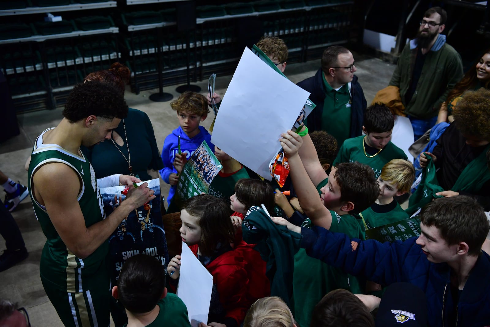 Wright State's Tanner Holden signs autographs for fans Saturday night at the Nutter Center. Joe Craven/WSU Athletics