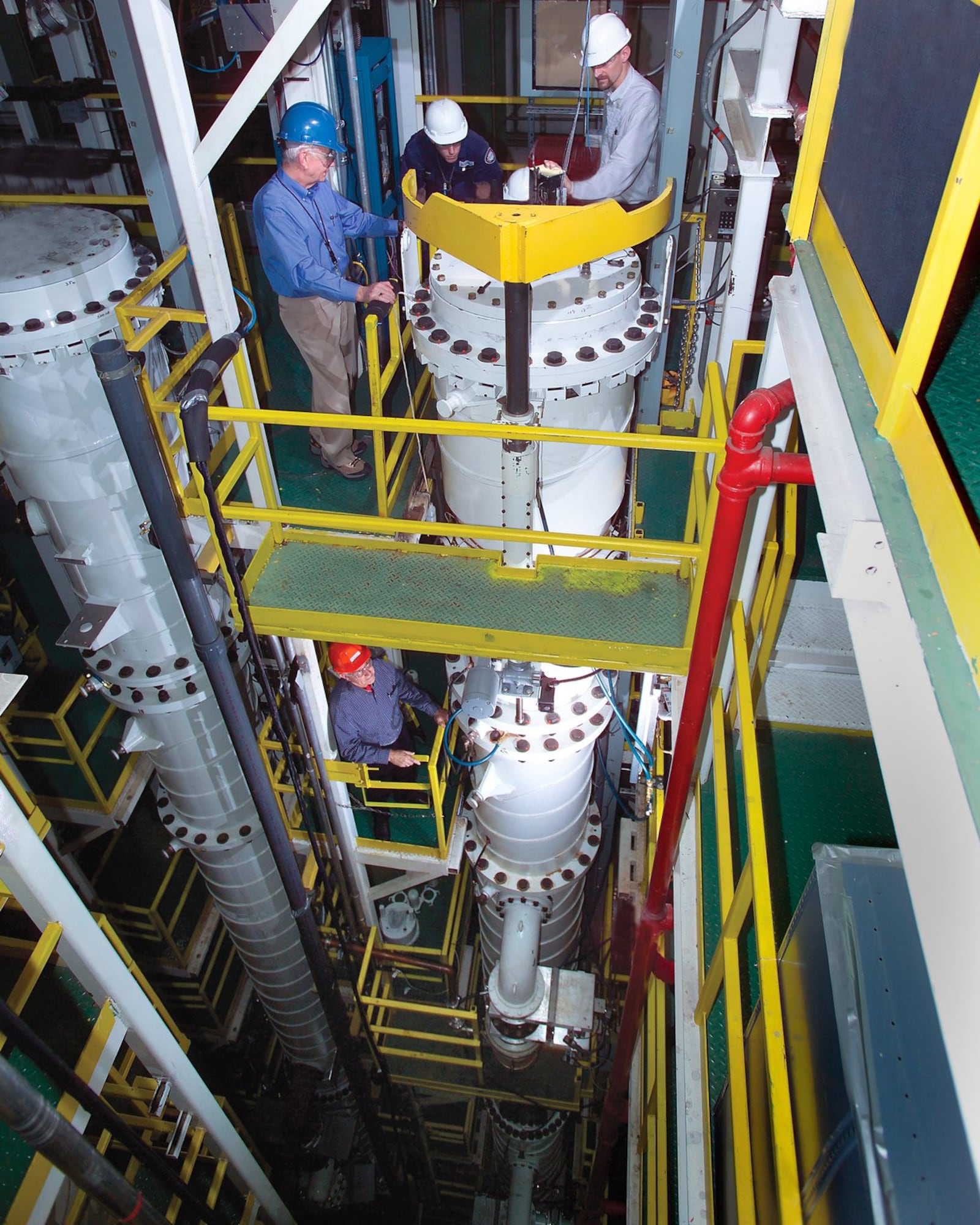 USEC employees test individual centrifuge machines during the spring of 2005 in Oak Ridge in preparation for testing numbers of centrifuges in a cascade formation in Piketon. The project later lost federal funding. USEC Inc. photo