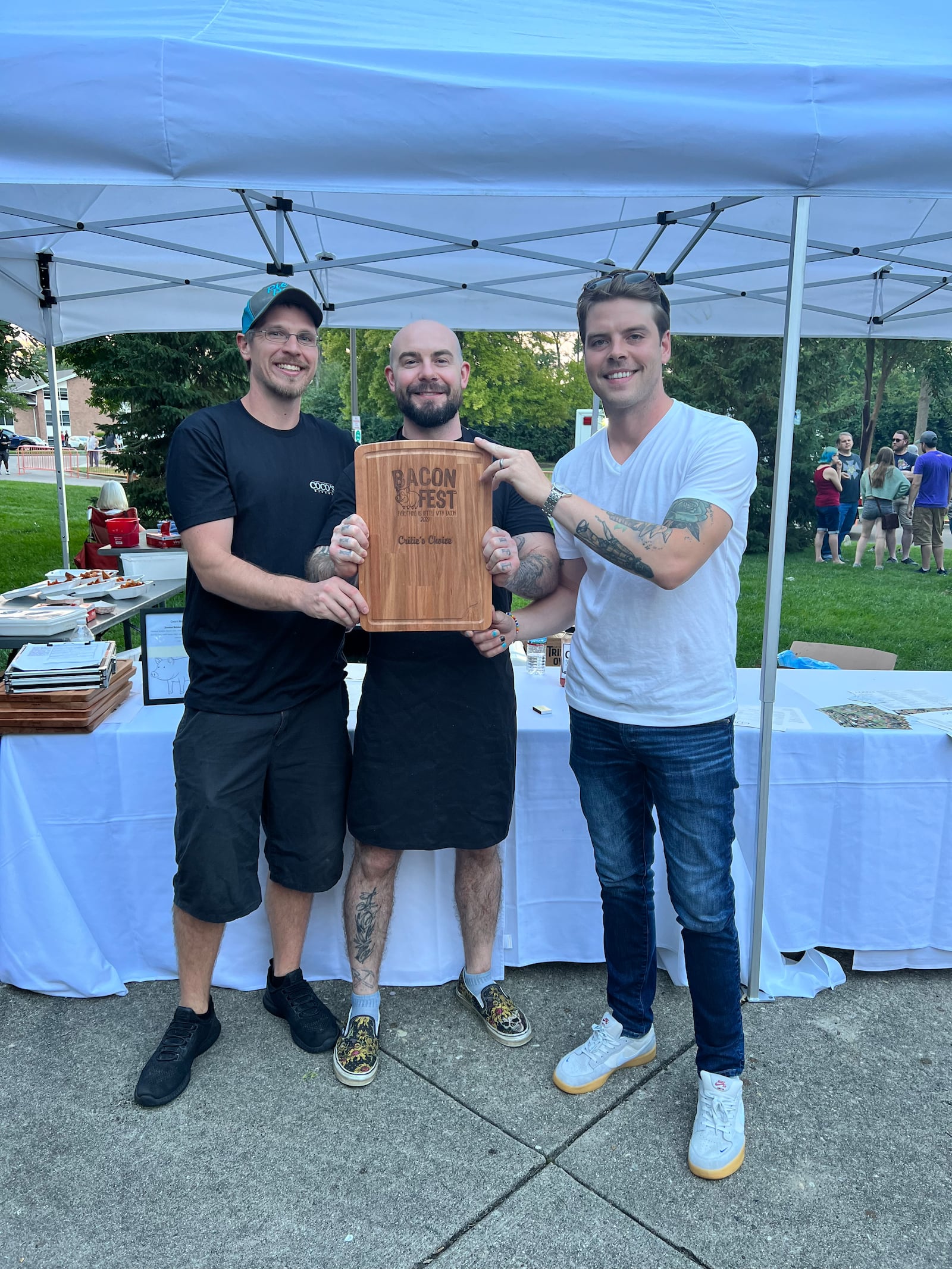 Coco's Bistro Kitchen Manager Zach Sharpe (left), Chef Bryan Ondre (center) and Adam Gilcher, Coco's General Manager (right) celebrate their Bacon Fest 2023 Critic's Choice win. ALEXIS LARSEN/CONTRIBUTOR