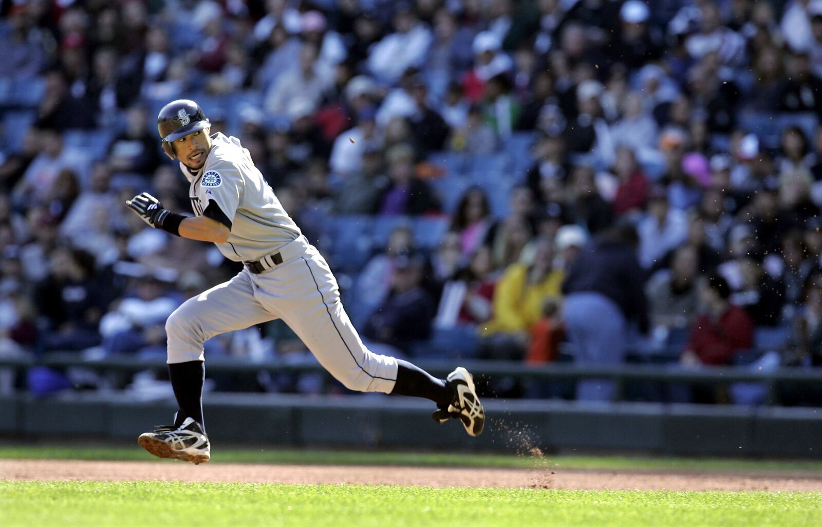 FILE - Seattle Mariners' Ichiro Suzuki glances toward home plate as he steals second base during the seventh inning of a baseball game against the Chicago White Sox Sunday, Sept. 24, 2006, in Chicago. (AP Photo/Jeff Roberson, File)