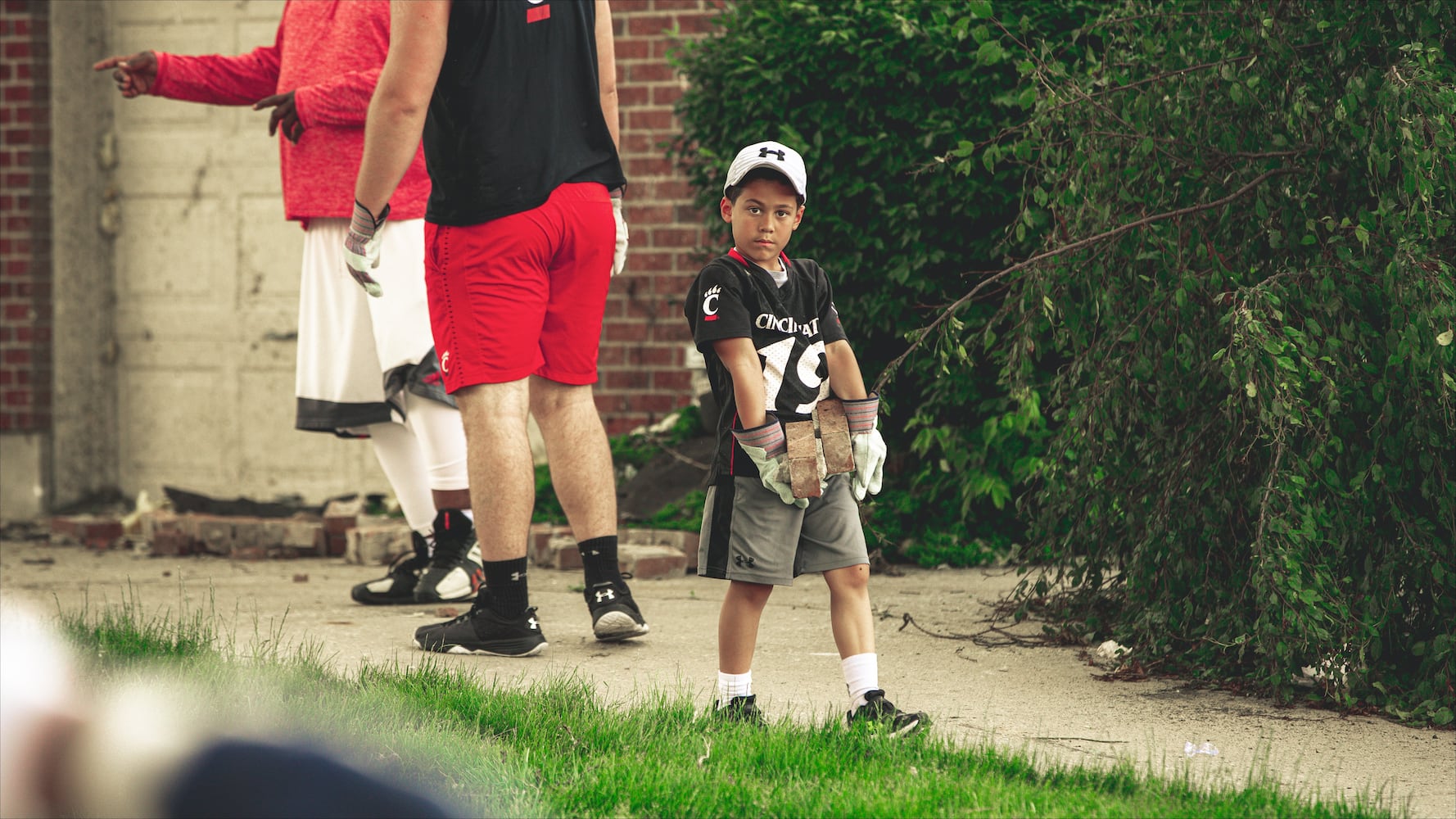 Gallery: Cincinnati Bearcats help clean up after Dayton tornado