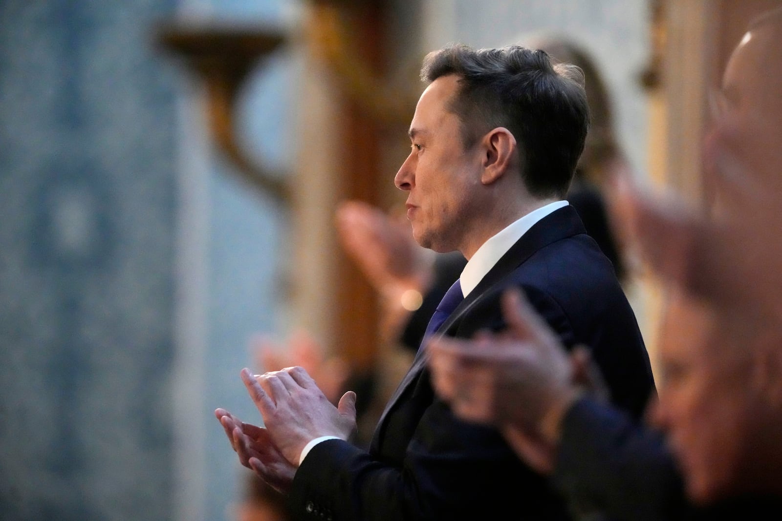 Elon Musk applauds as President Donald Trump addresses a joint session of Congress at the Capitol in Washington, Tuesday, March 4, 2025. (AP Photo/Ben Curtis)